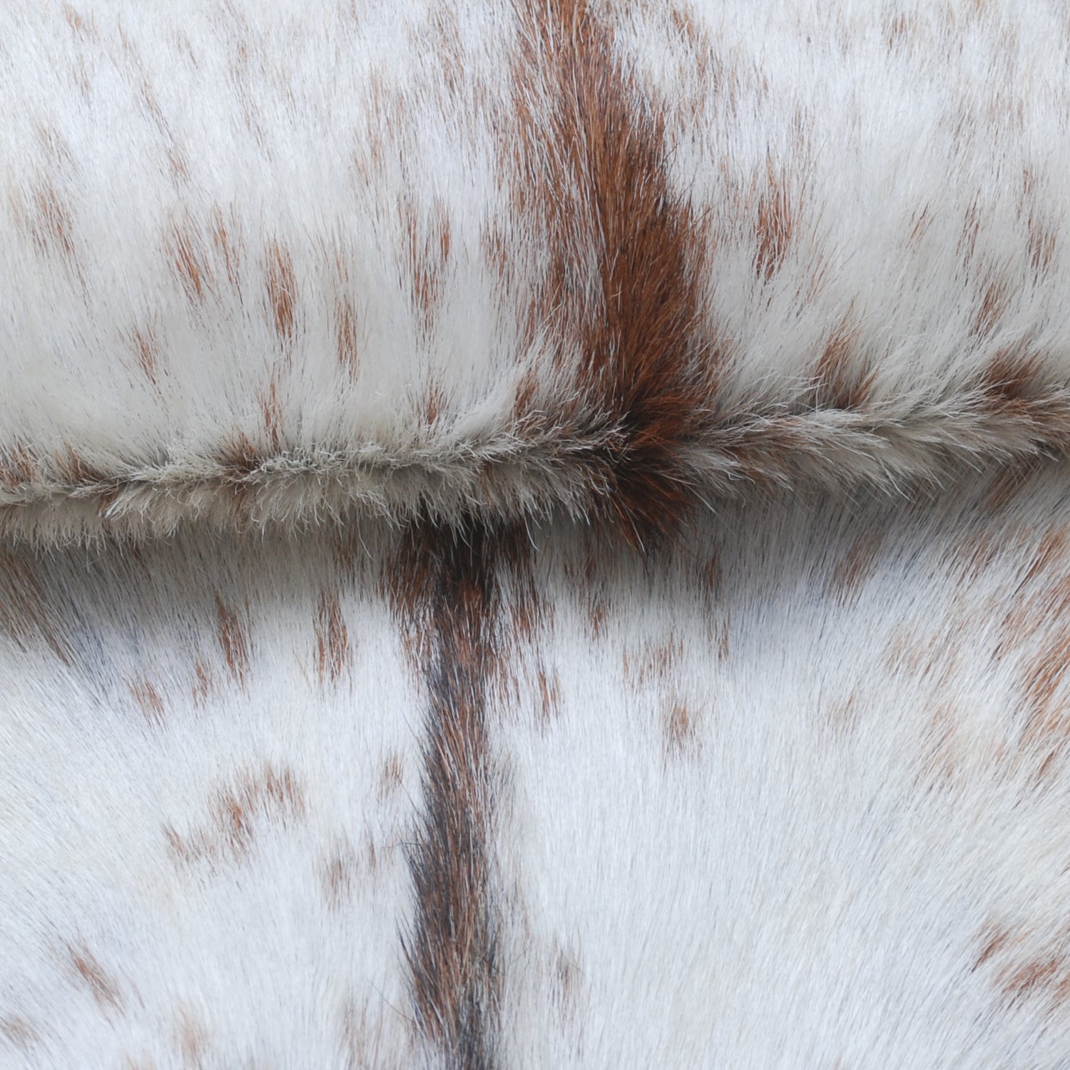 Handcrafted Brown and White Goat Skin Rug - Soft, Durable, and Elegant Décor