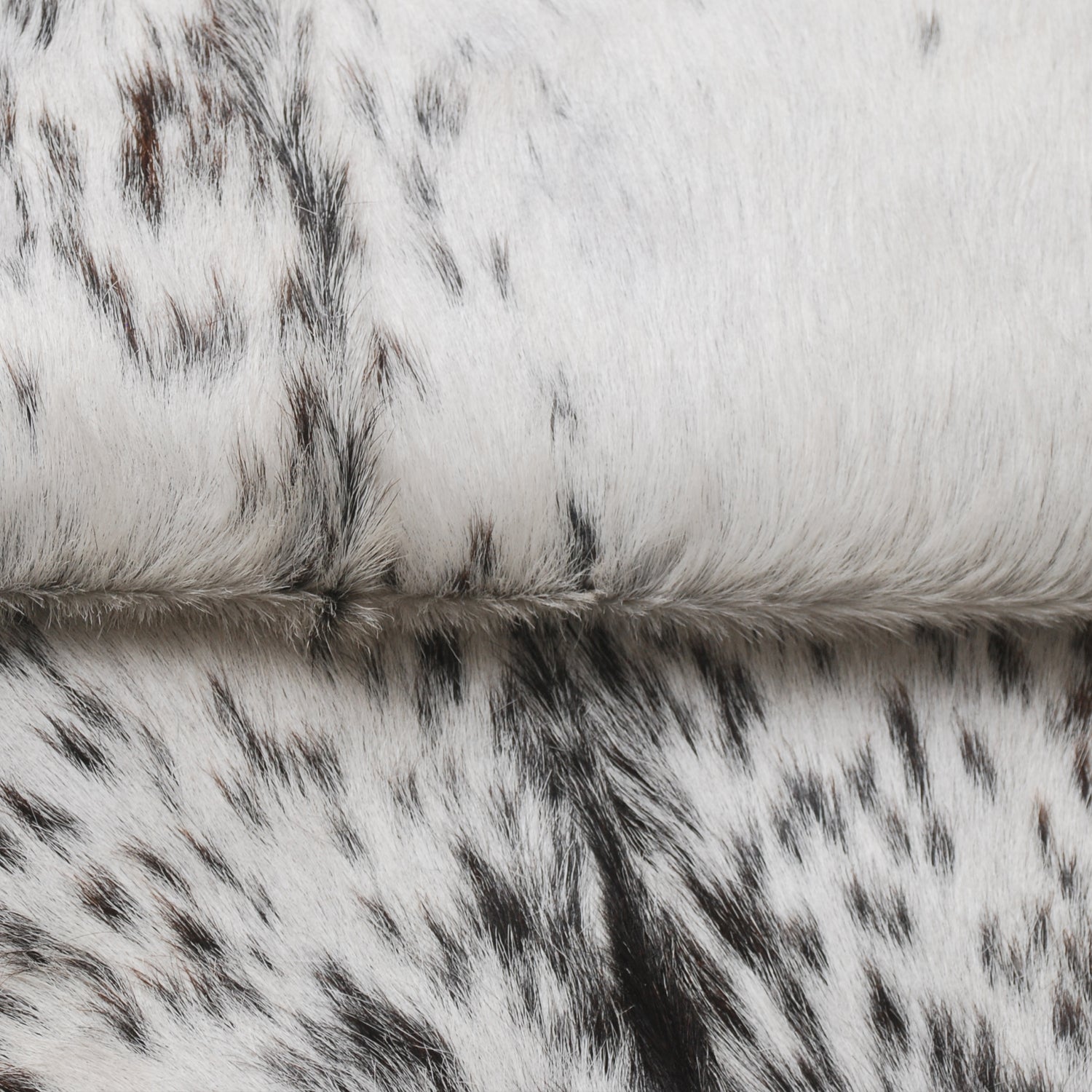 Stylish Black and White Goat Hide Rug - Unique Natural Pattern for Modern Homes