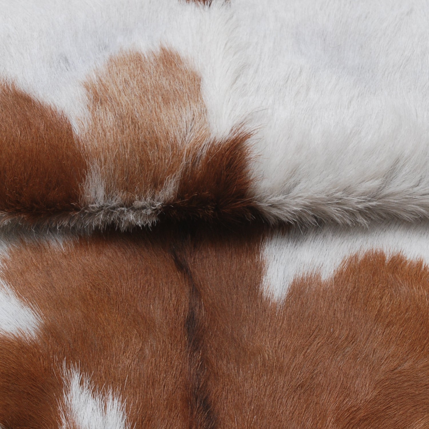 Handcrafted Brown and White Goat Skin Rug - Soft, Durable, and Elegant Décor