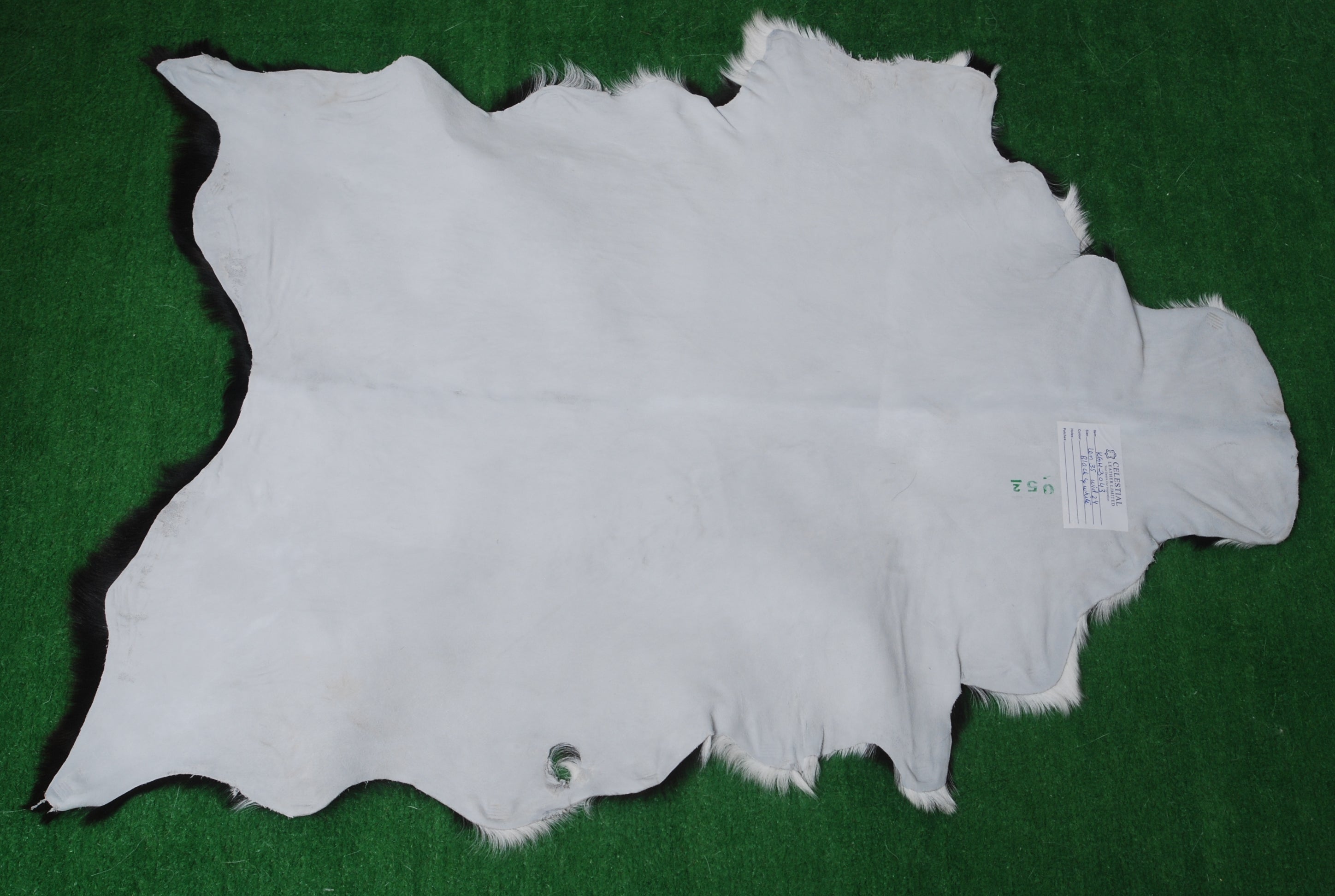 Elegant Black and White Goat Hide Rug - Perfect Accent for Any Room