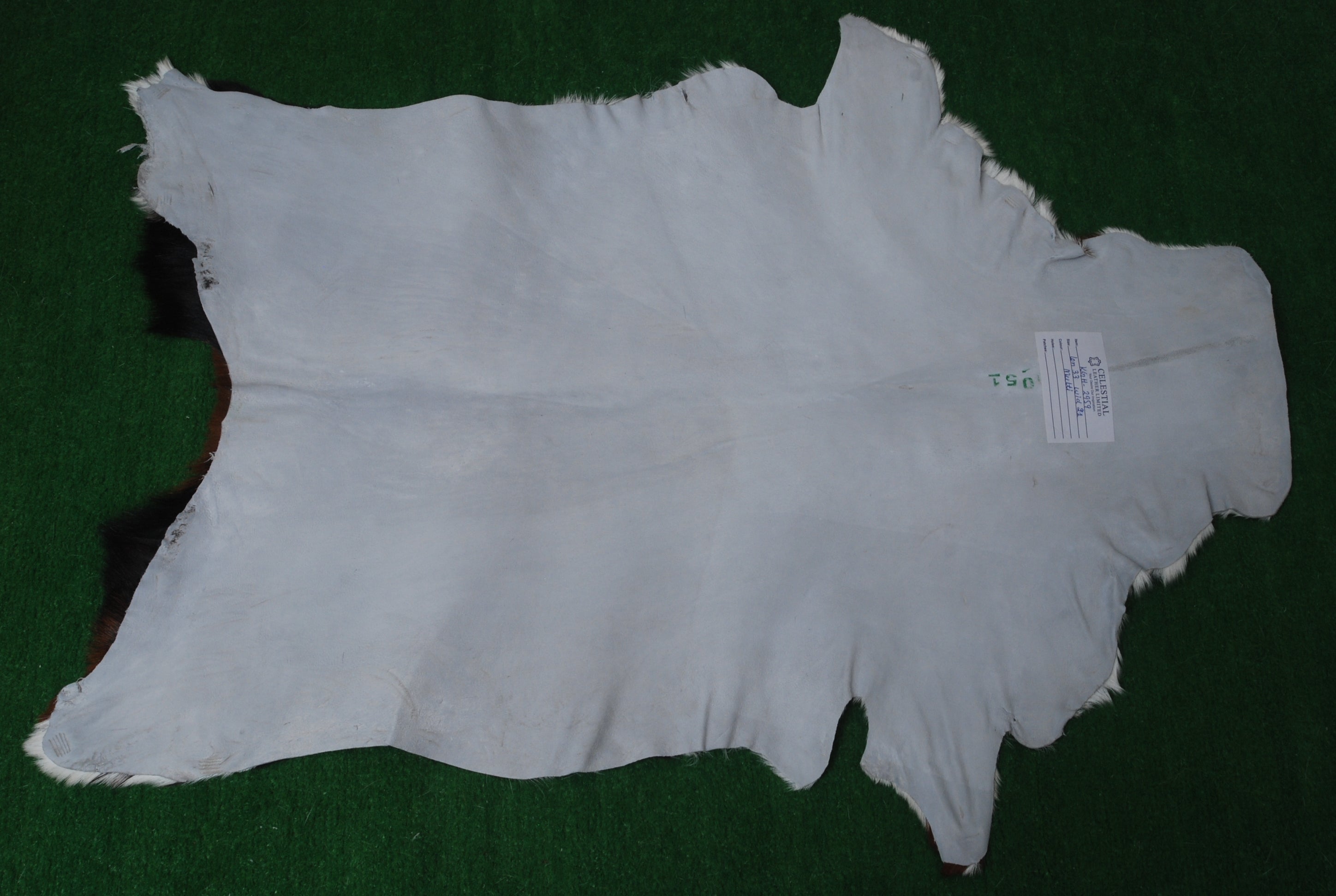 Luxury Handmade Dark Brown White Goat Skin Rug with Non-Slip Suede Backing - Eco-Friendly Natural Beauty for High-Traffic Areas - Celestial Leather Limited