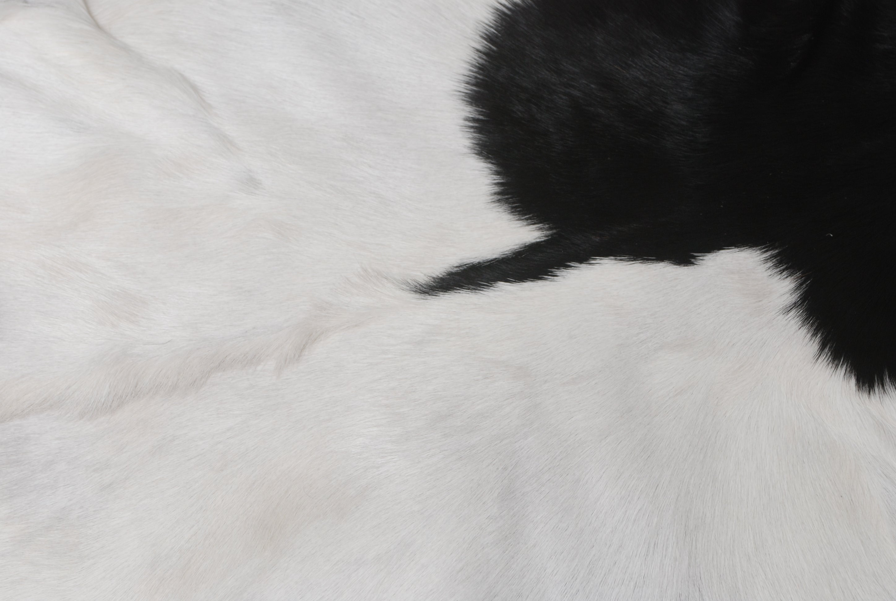 Rustic Black and White Goat Hide Rug - Perfect for Floor or Wall Décor