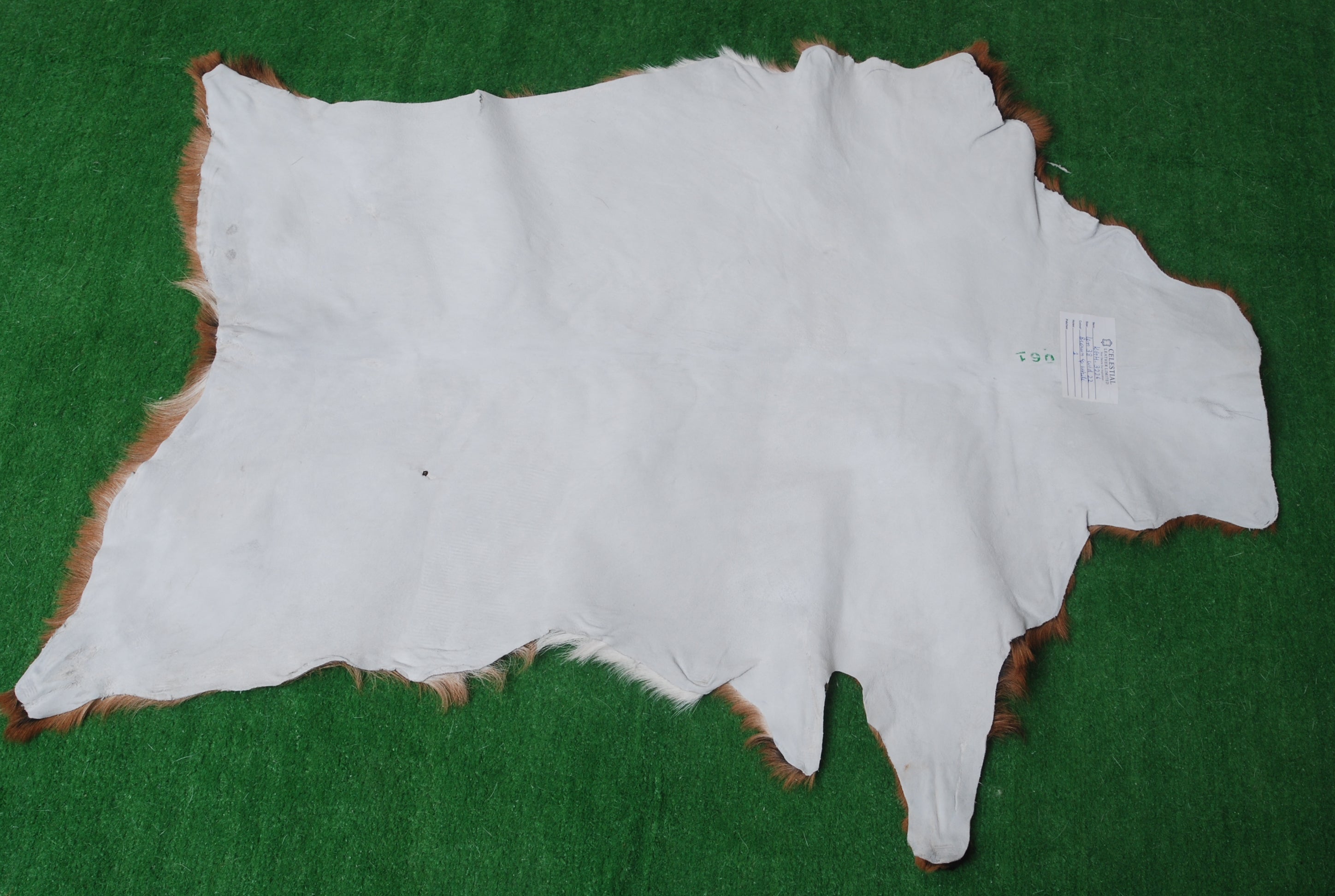 Natural Hair-On Dark Brown Goat Skin Rug - Elegant and Durable for Any Room