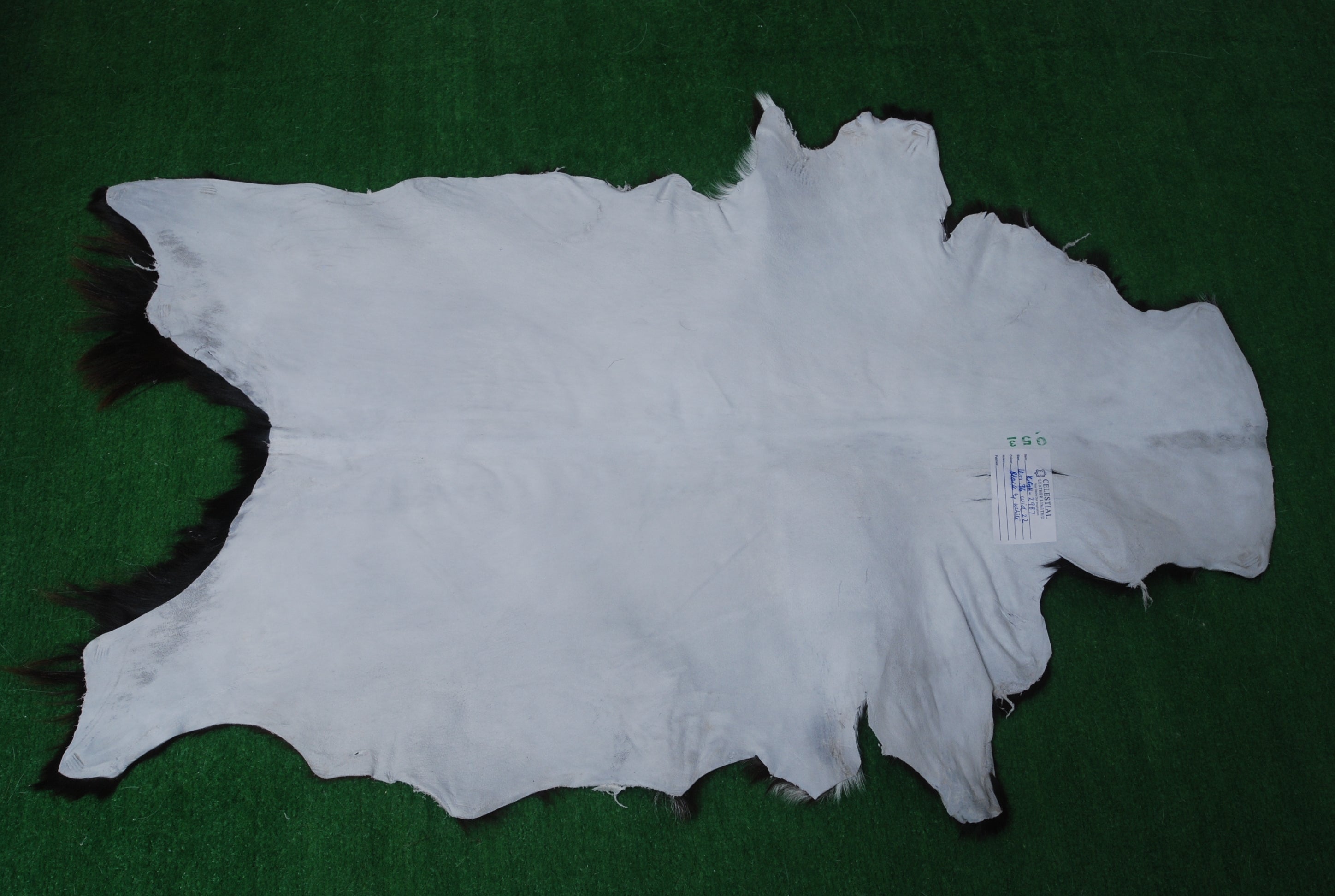 Natural Black and White Goat Hide Rug - Luxurious and Stylish Floor Accent