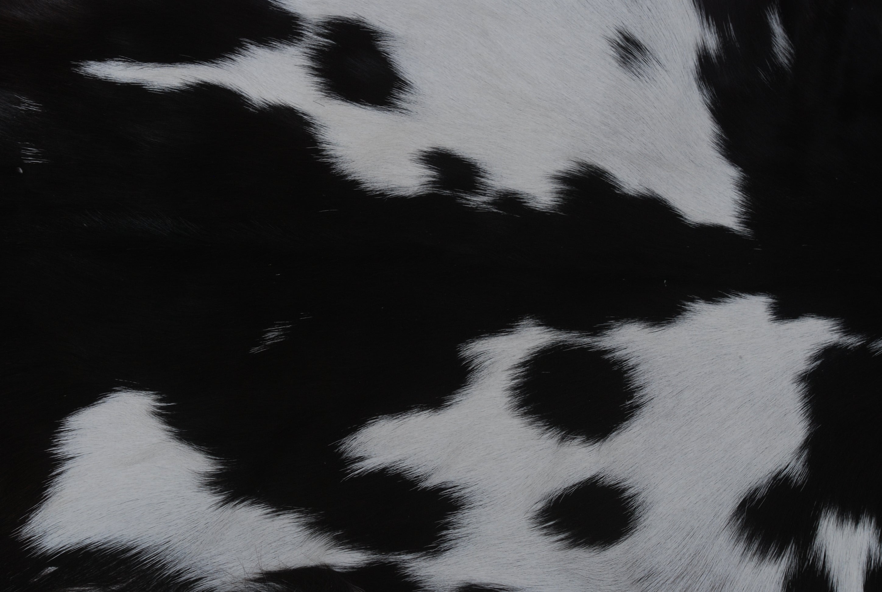 Natural Black and White Goat Hide Rug - Luxurious and Stylish Floor Accent