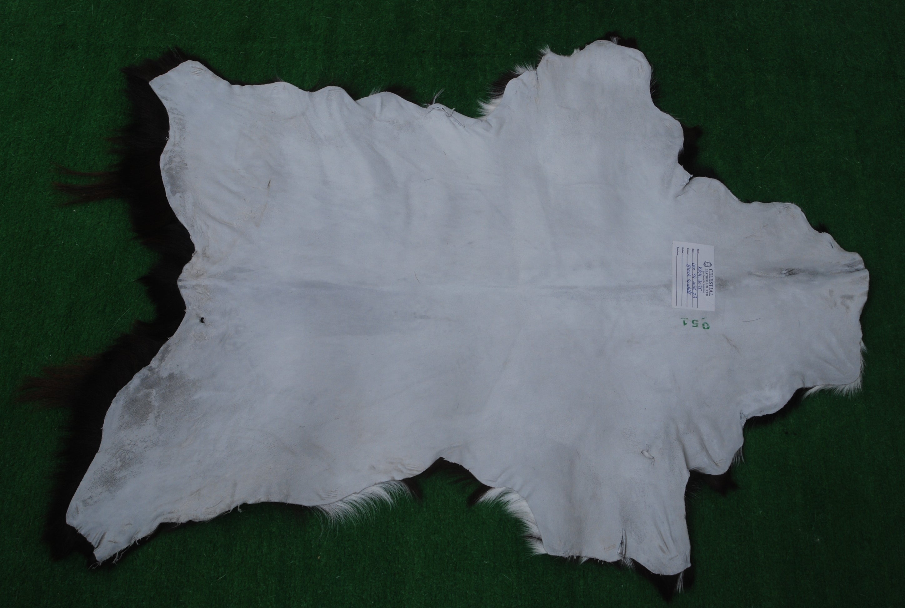 Elegant Black and White Goat Hide Rug - Perfect Accent for Any Room