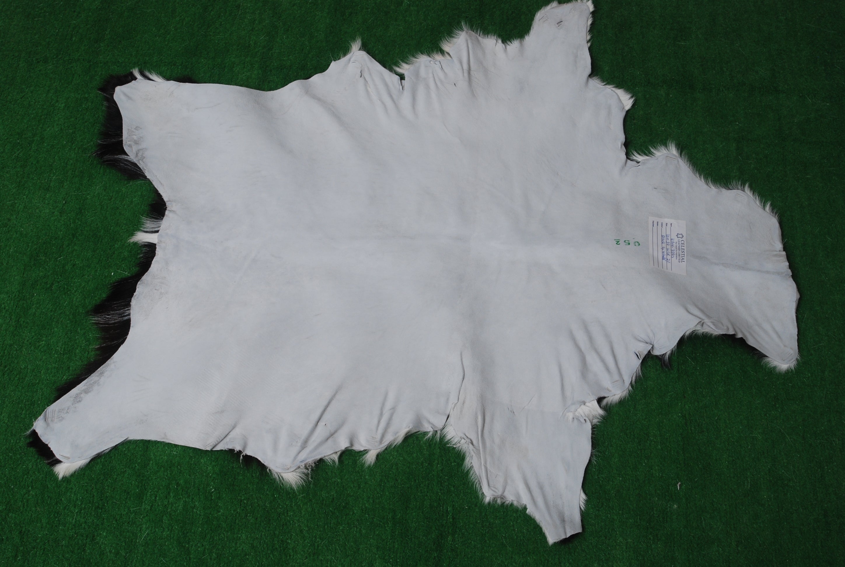 Stylish Black and White Goat Hide Rug - Unique Natural Pattern for Modern Homes