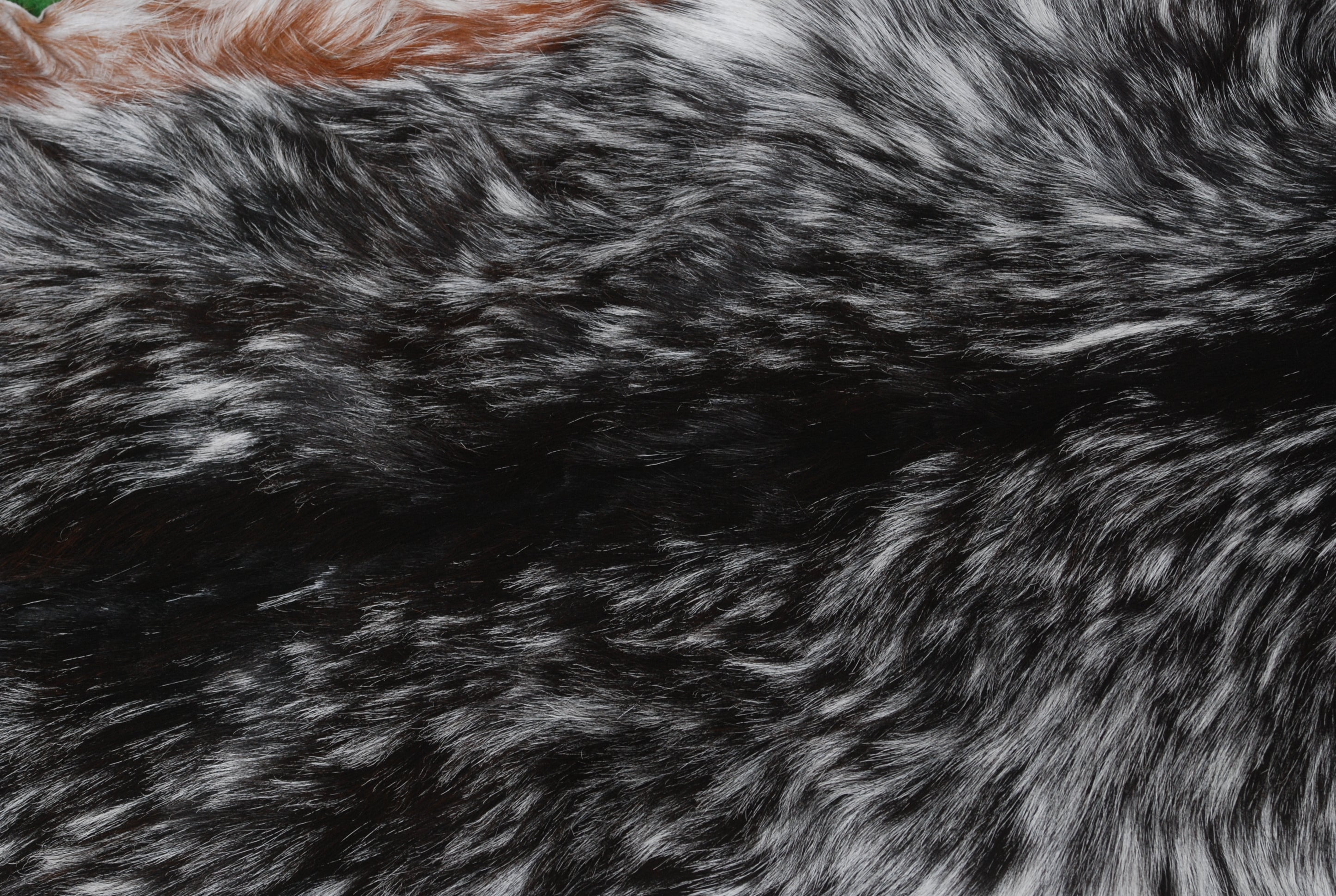 Rustic Black and White Goat Hide Rug - Perfect for Floor or Wall Décor