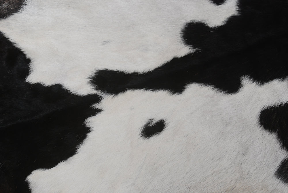 Luxurious Handmade Black & White Goat Skin Rug: Soft, Hypoallergenic, Sustainable, Non-Shedding & Unique - Add Nature's Beauty to Your Home - Celestial Leather Limited