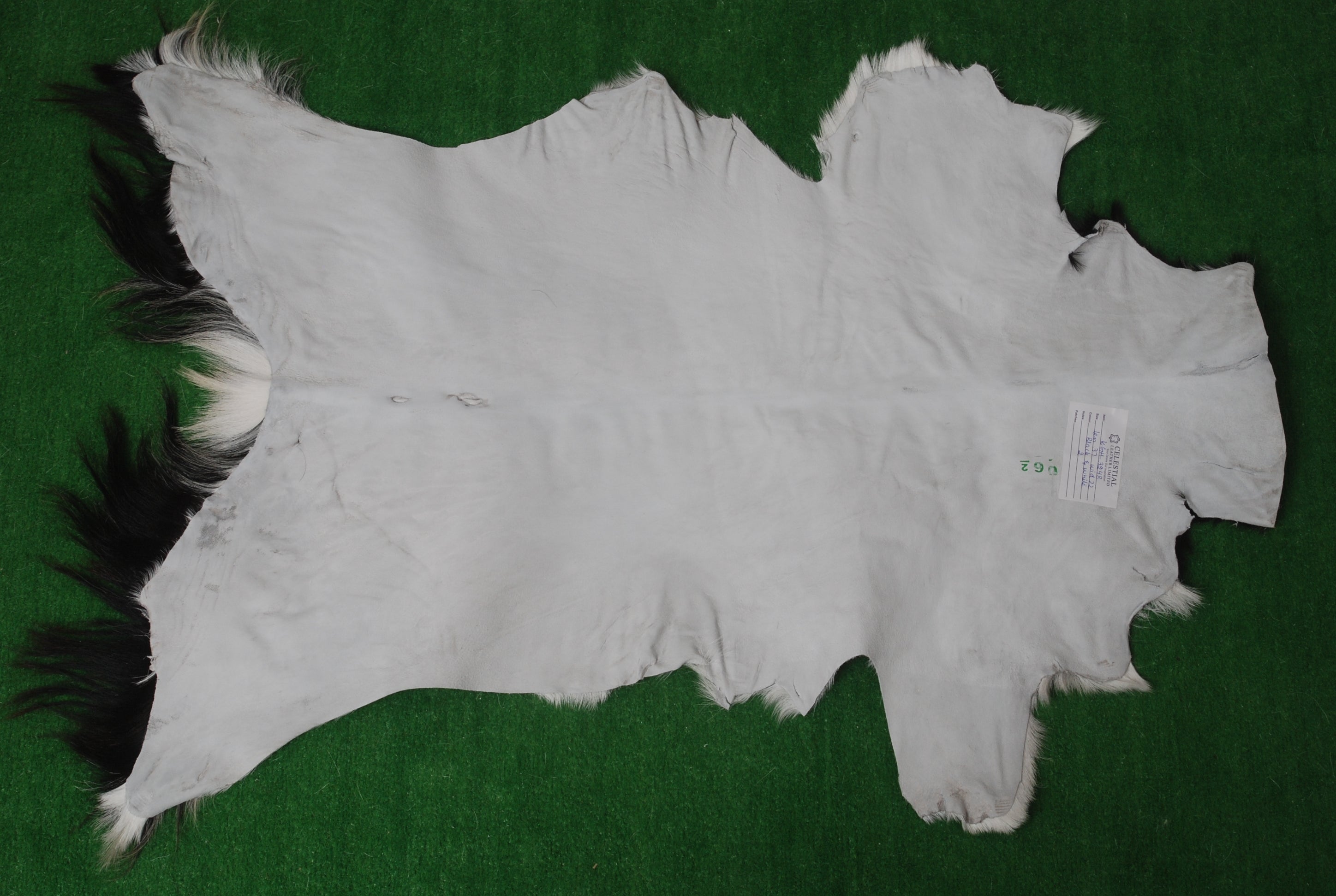 Luxurious Black & White Goat Skin Rug Perfect for Modern Spaces - Celestial Leather Limited