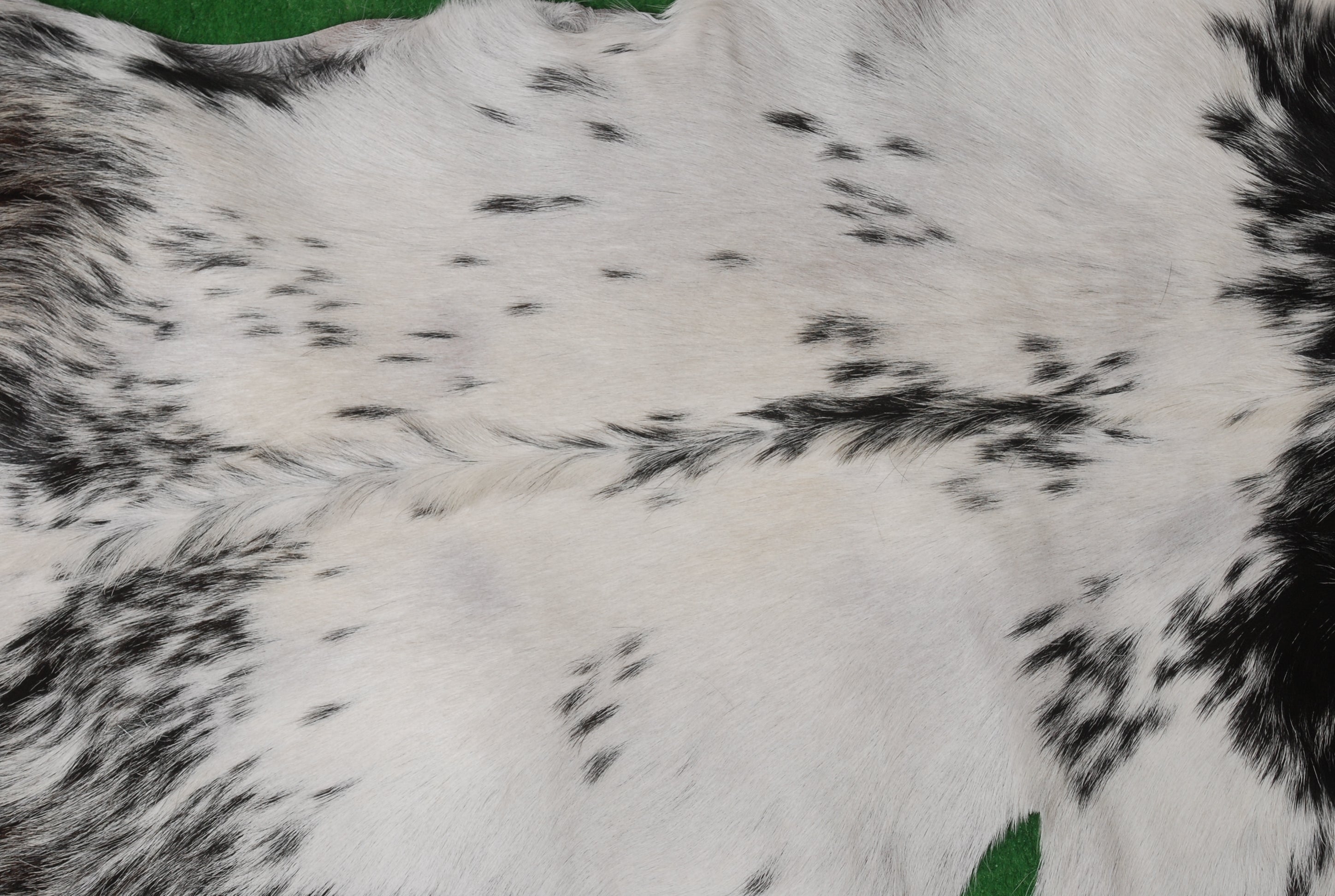 Luxurious Black & White Goat Skin Rug Perfect for Modern Spaces - Celestial Leather Limited