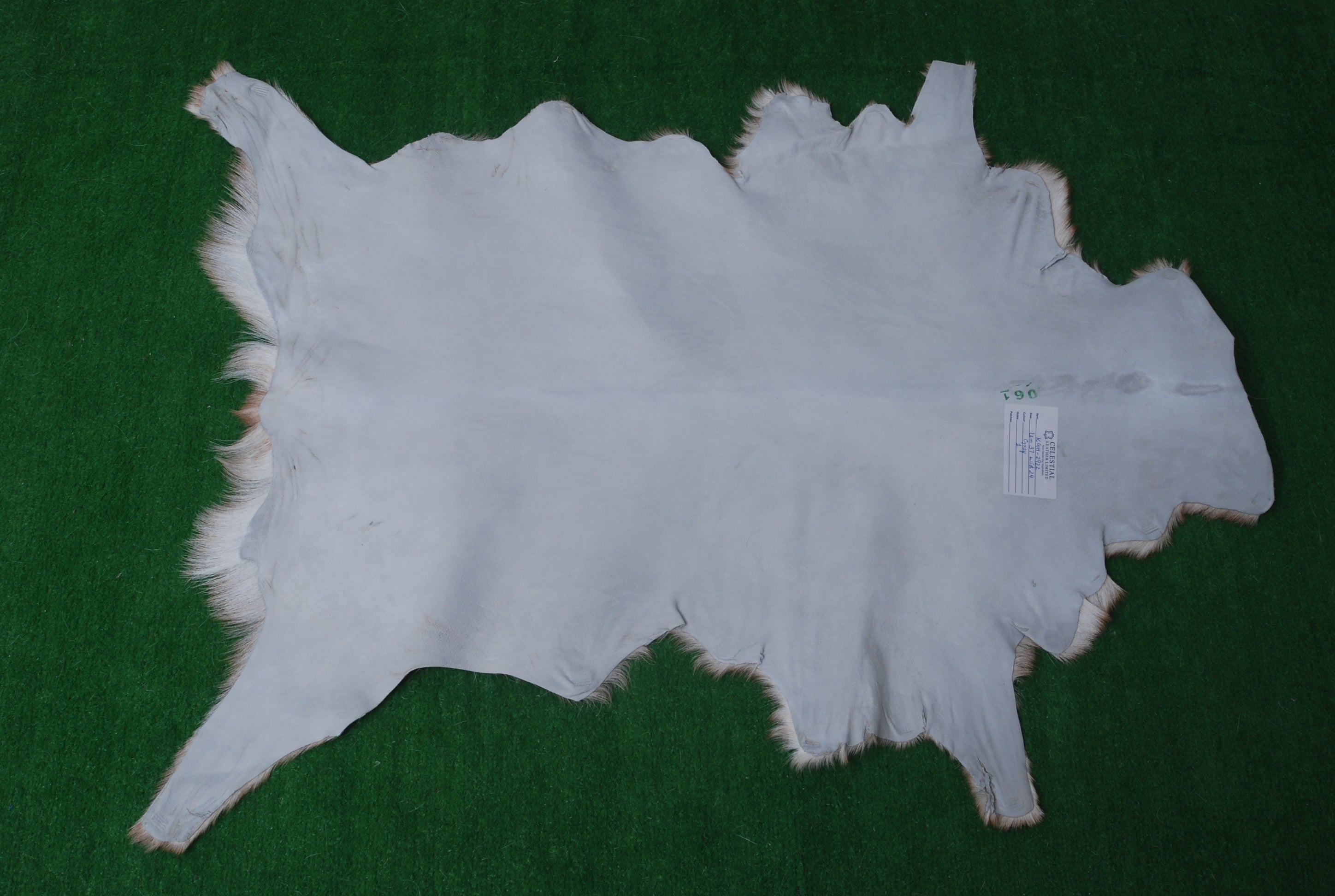 Premium Brown and White Goat Hide Rug - Natural, Handcrafted, Non-Slip Suede Back, Eco-Friendly & Sustainable - Hypoallergenic - Celestial Leather Limited