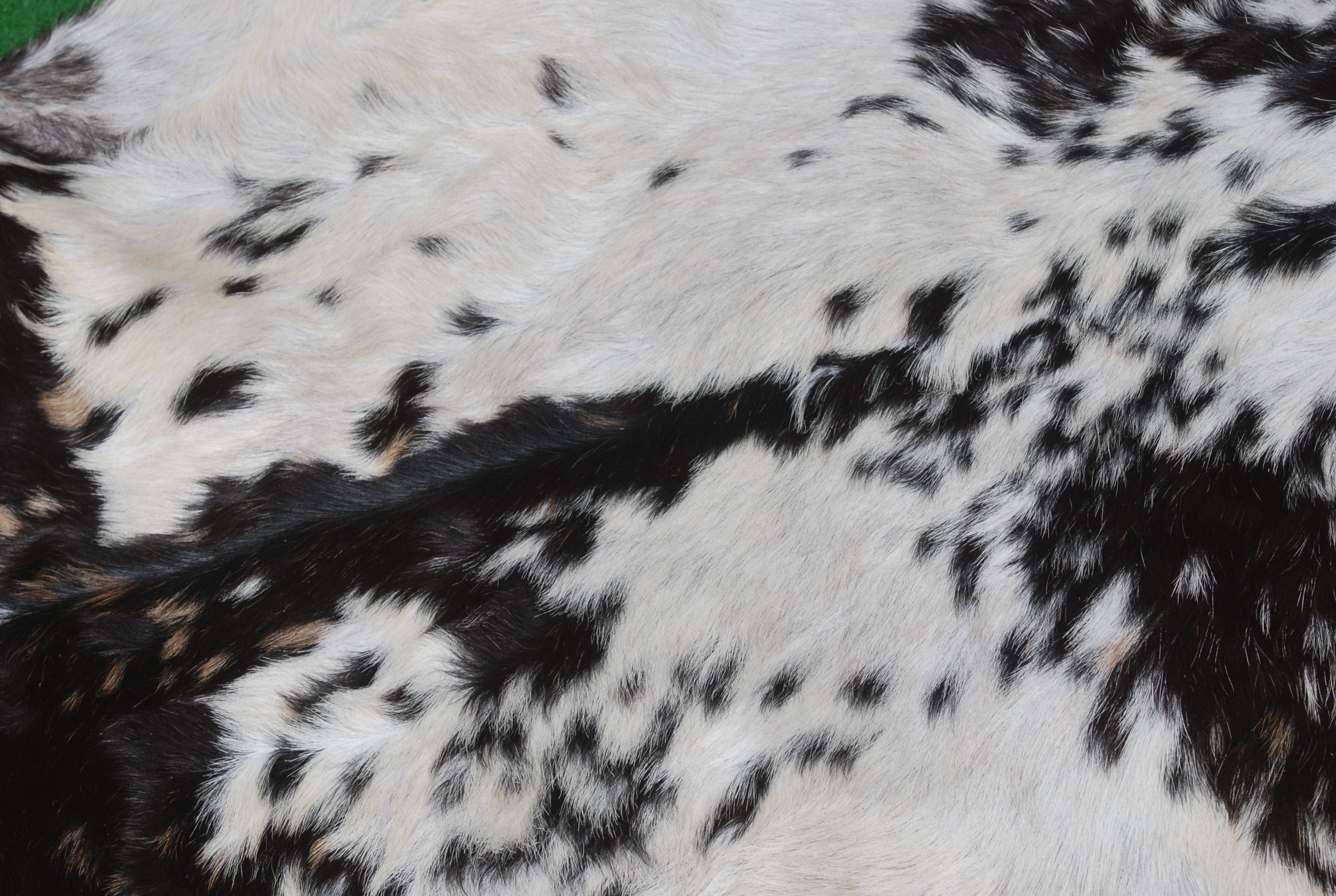 Decorative Black and White Goat Skin Rug - Genuine Leather for Sophisticated Spaces