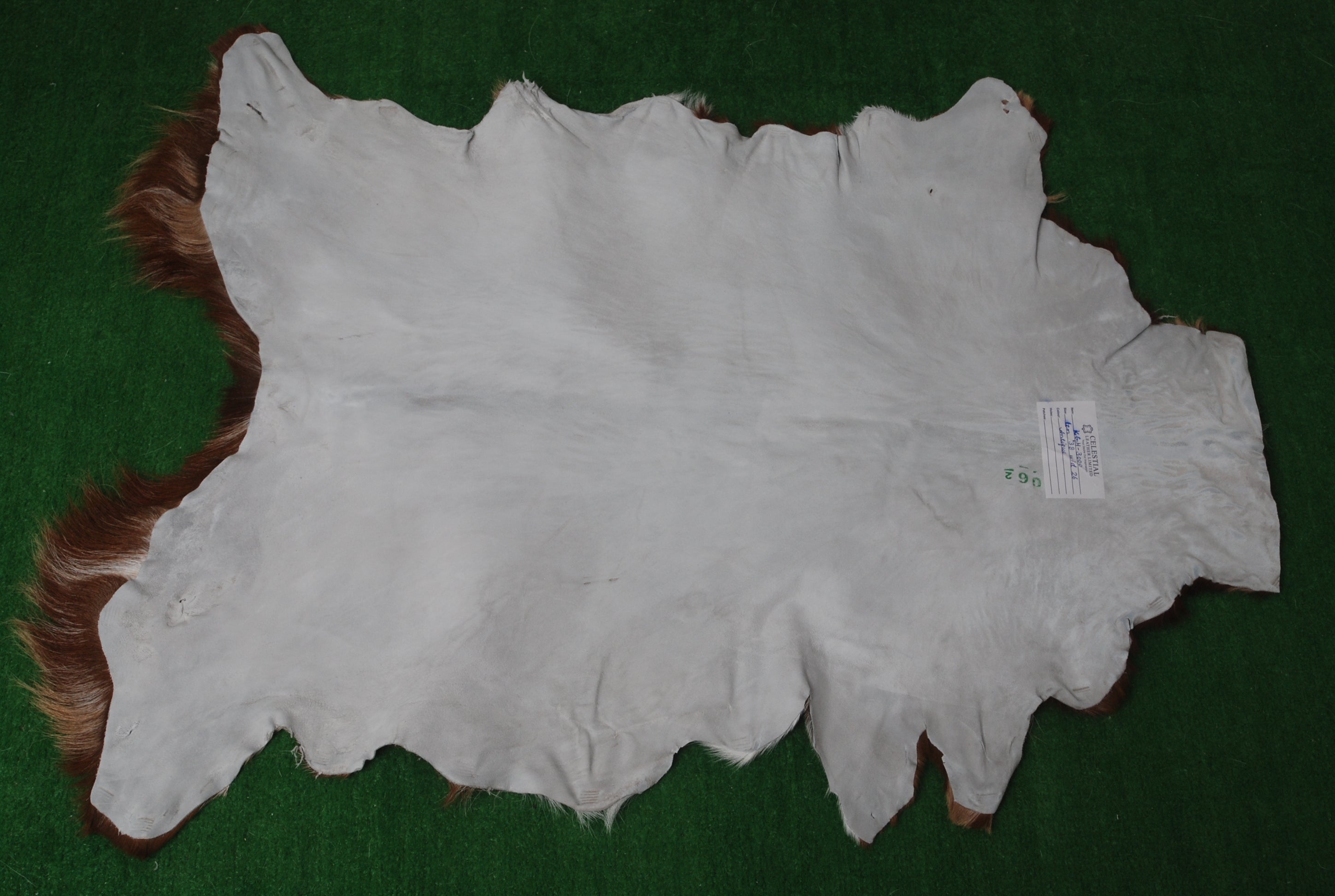 Handcrafted Tri-Color Goat Skin Rug - Soft and Durable for Elegant Interiors