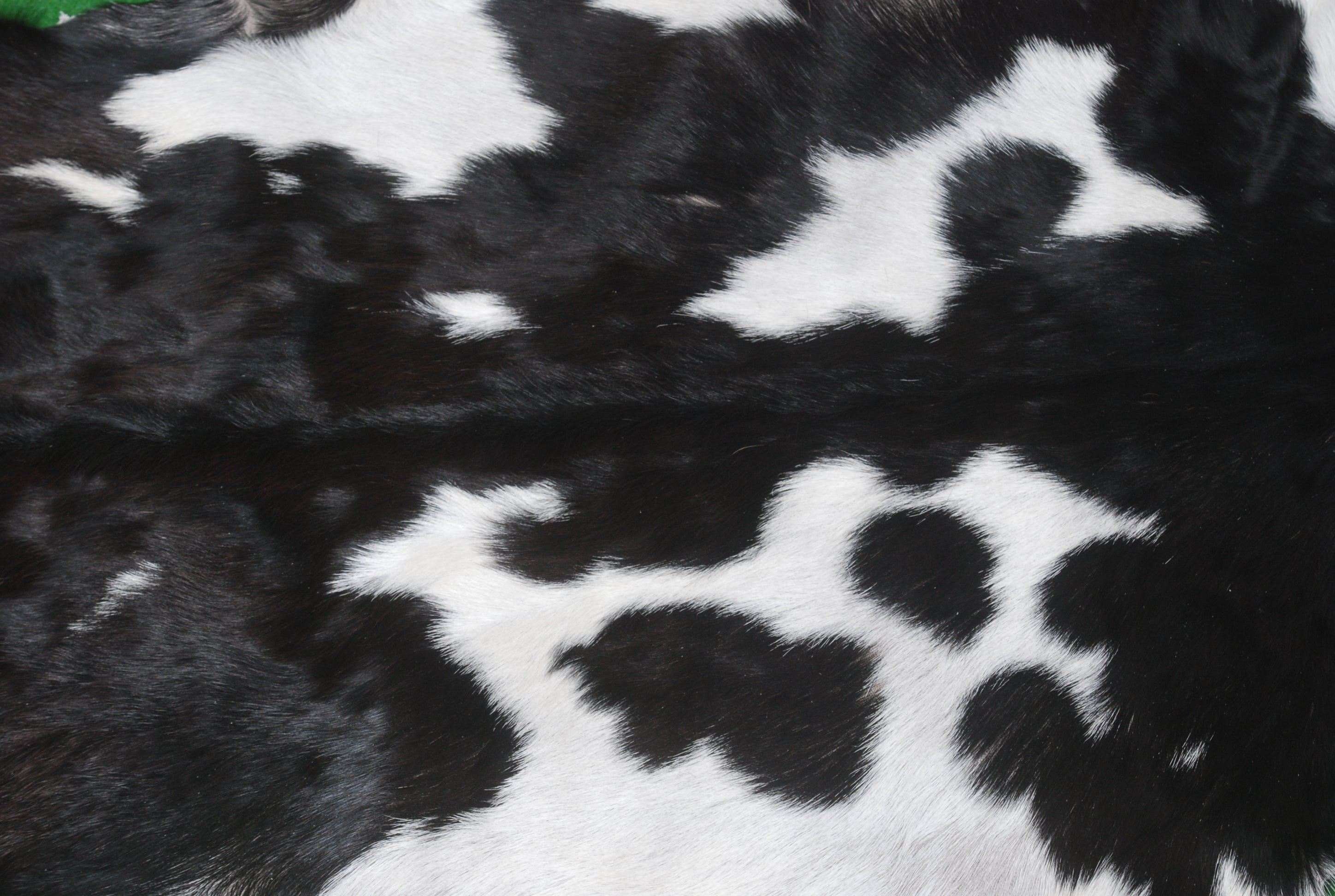 Black and White Handmade Goat Skin Rug – Natural Luxury for Your Home