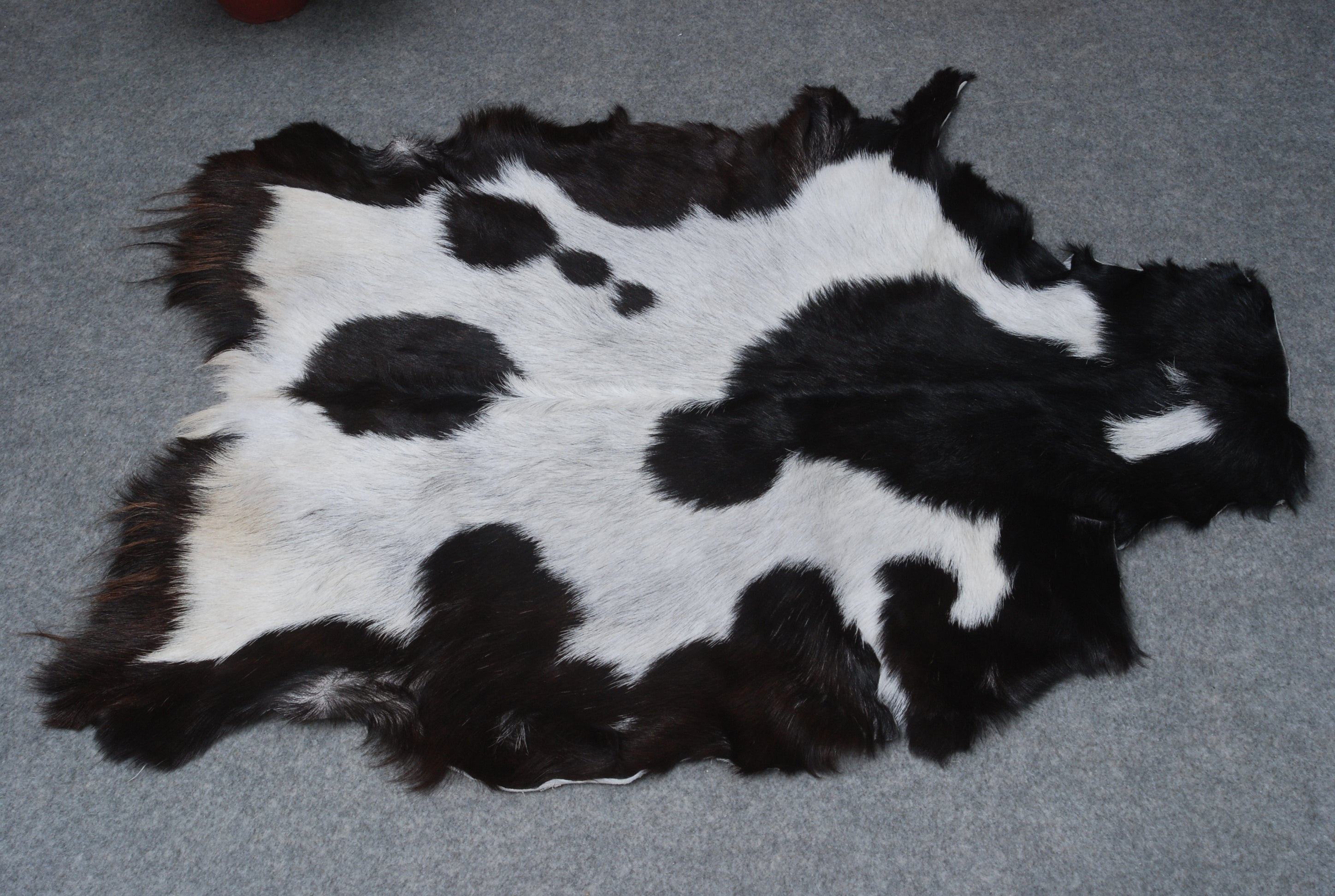 Premium Black and White Goat Skin Rug - Genuine Hair-On Leather for Home Décor