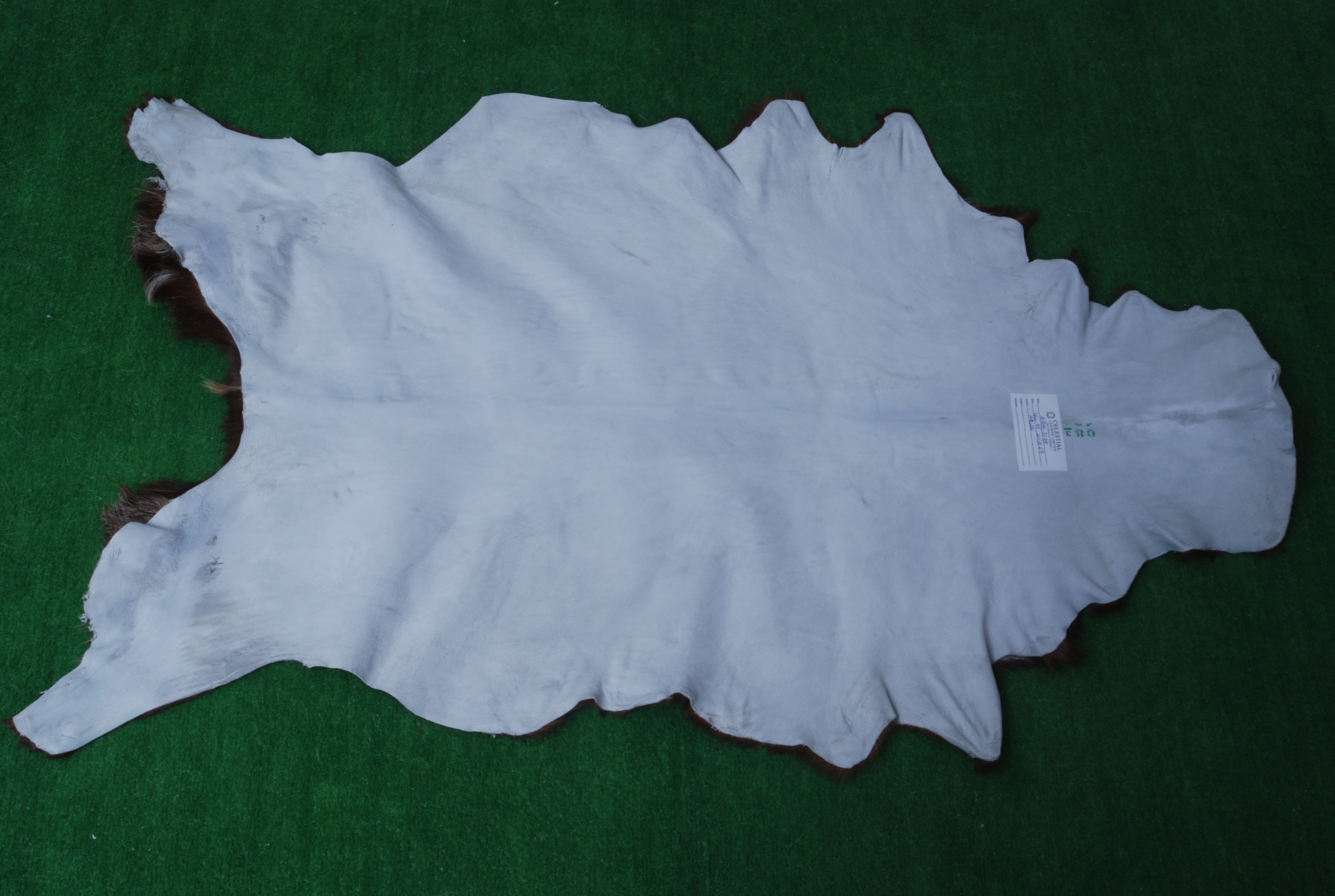 Decorative Brown and White Goat Hide Rug - Perfect for Floor or Wall Accents