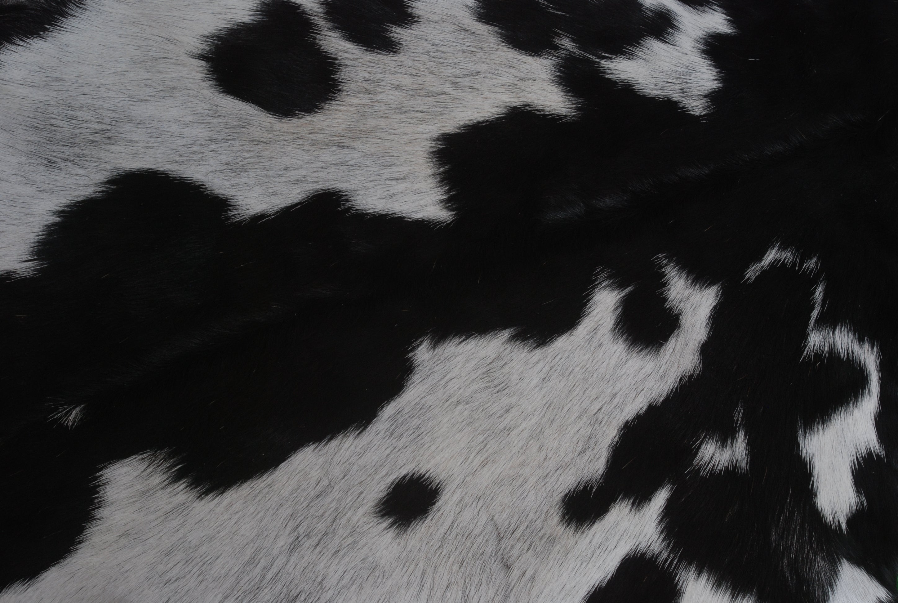 Natural Black and White Goat Hide Rug - Luxurious and Stylish Floor Accent