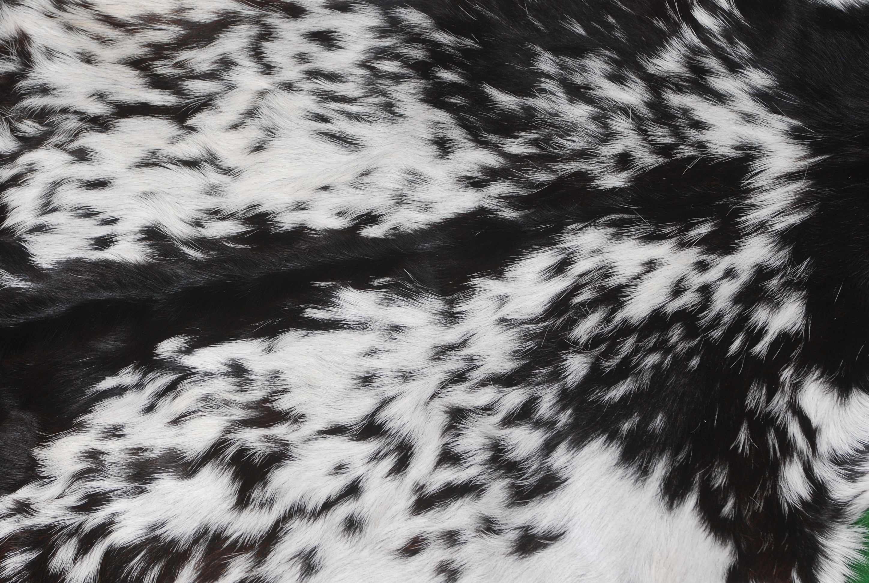 Decorative Black and White Goat Skin Rug - Genuine Leather for Sophisticated Spaces