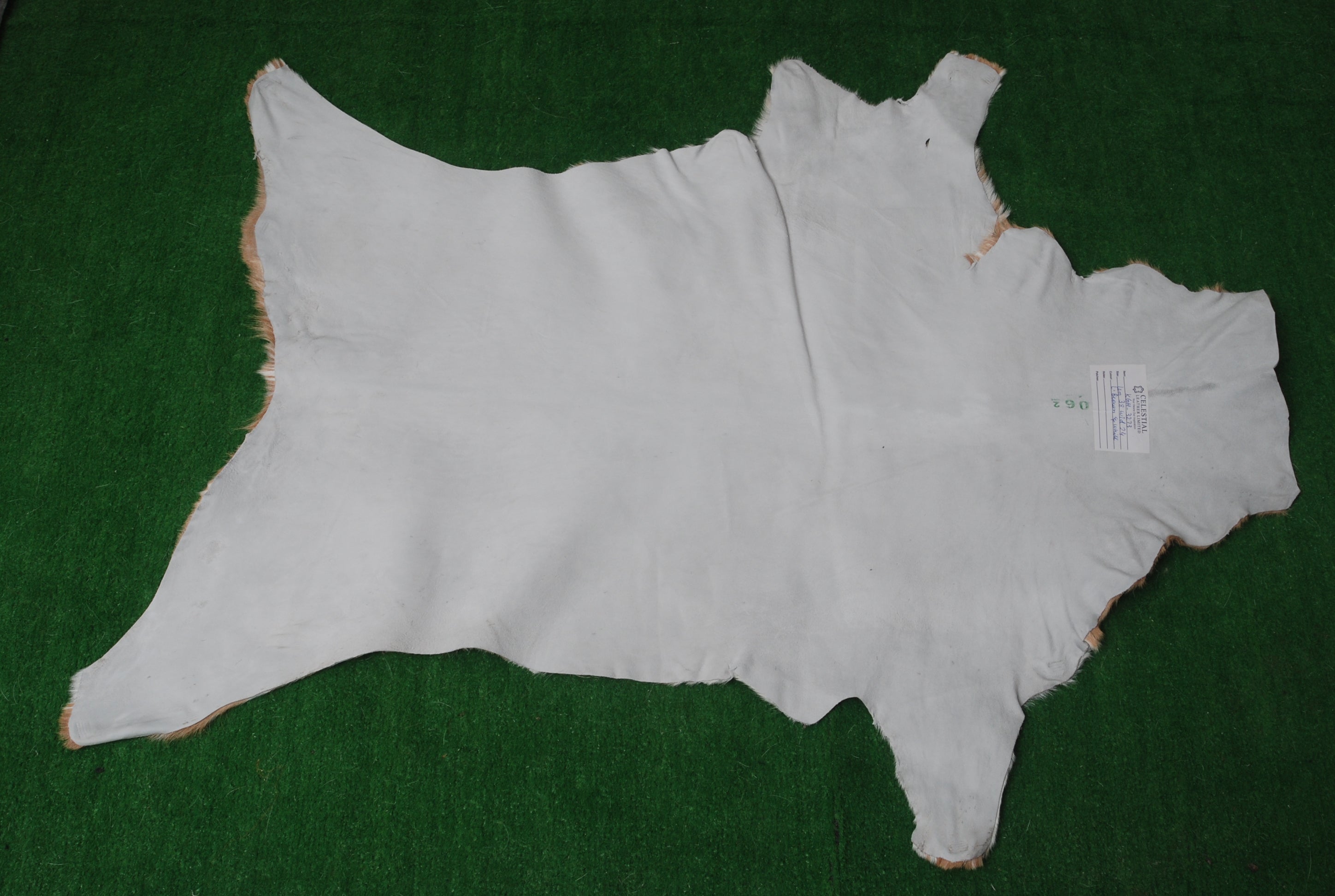 Rustic Brown and White Goat Skin Rug - Unique Pattern for Modern and Classic Décor