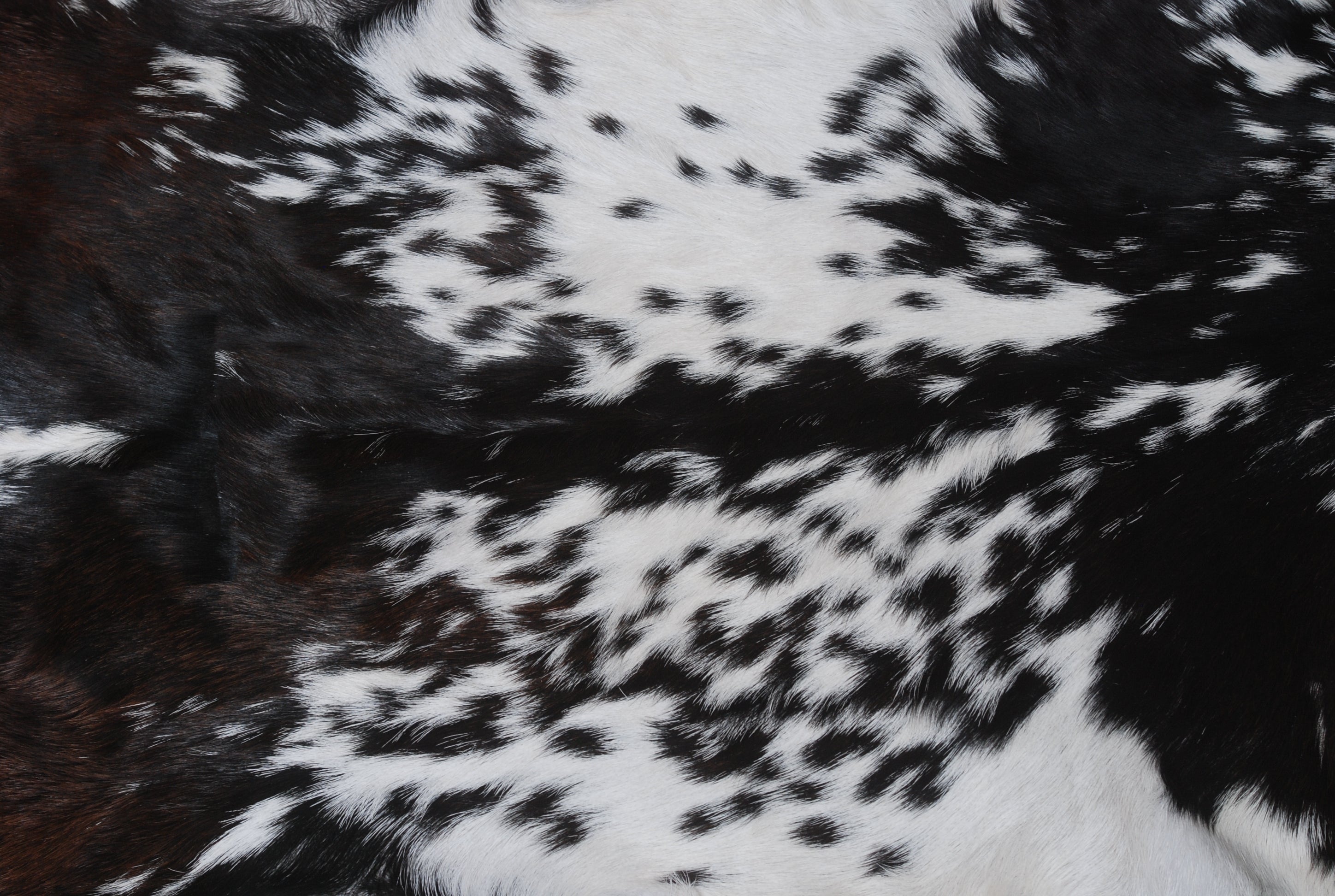 Natural Black and White Goat Hide Rug - Luxurious and Stylish Floor Accent