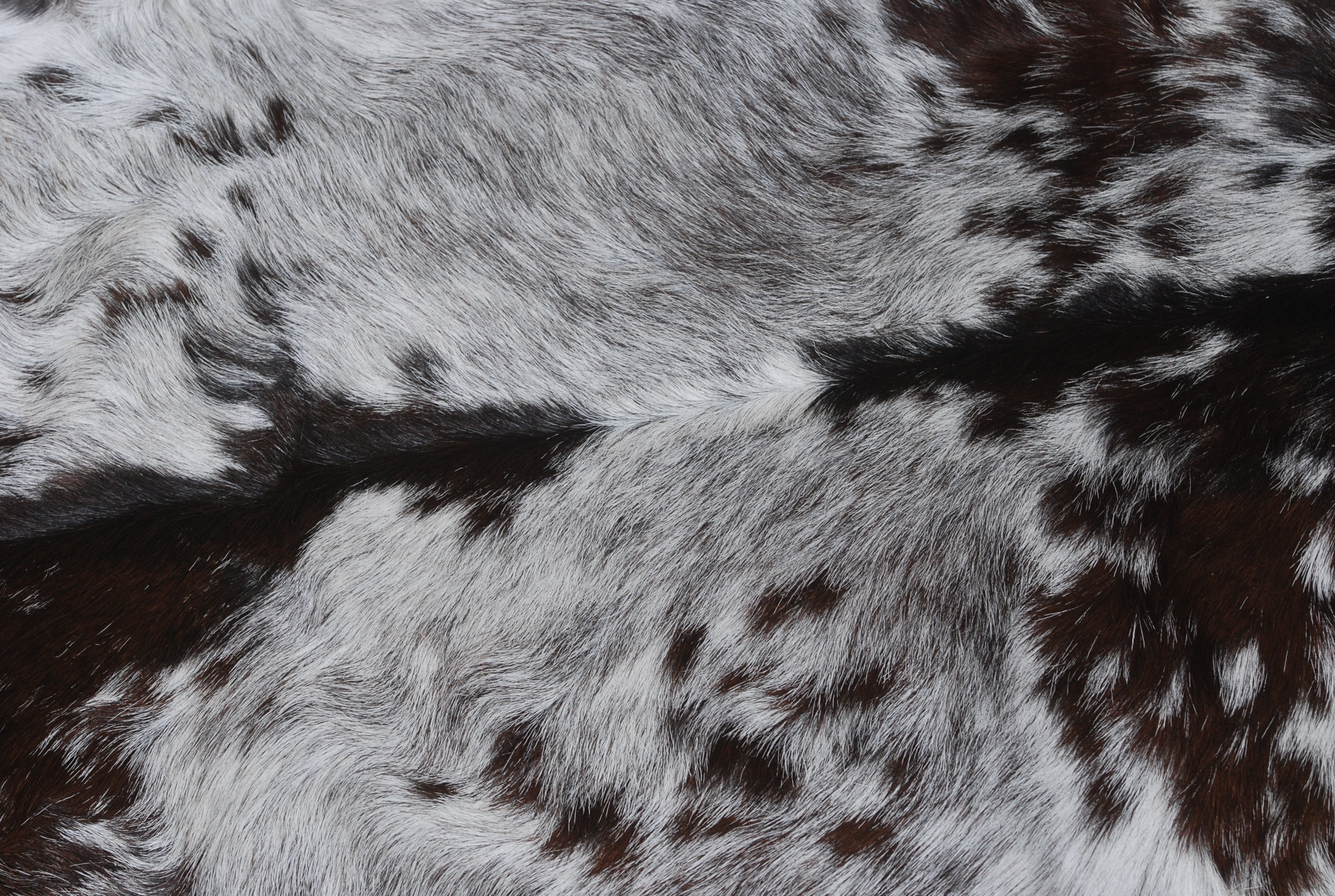 Elegant Black and White Goat Hide Rug - Perfect Accent for Any Room