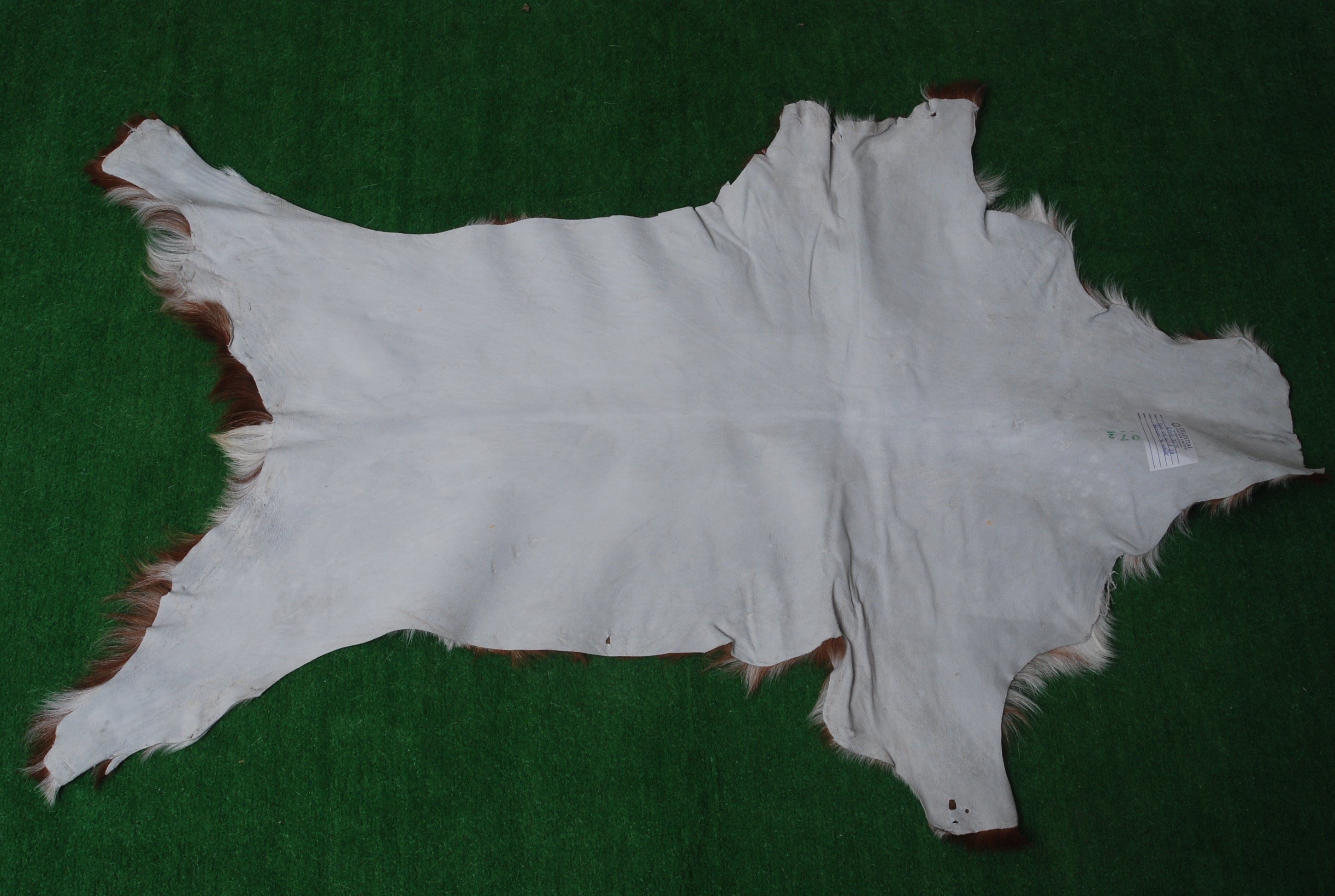 Natural Hair-On Dark Brown Goat Skin Rug - Elegant and Durable for Any Room