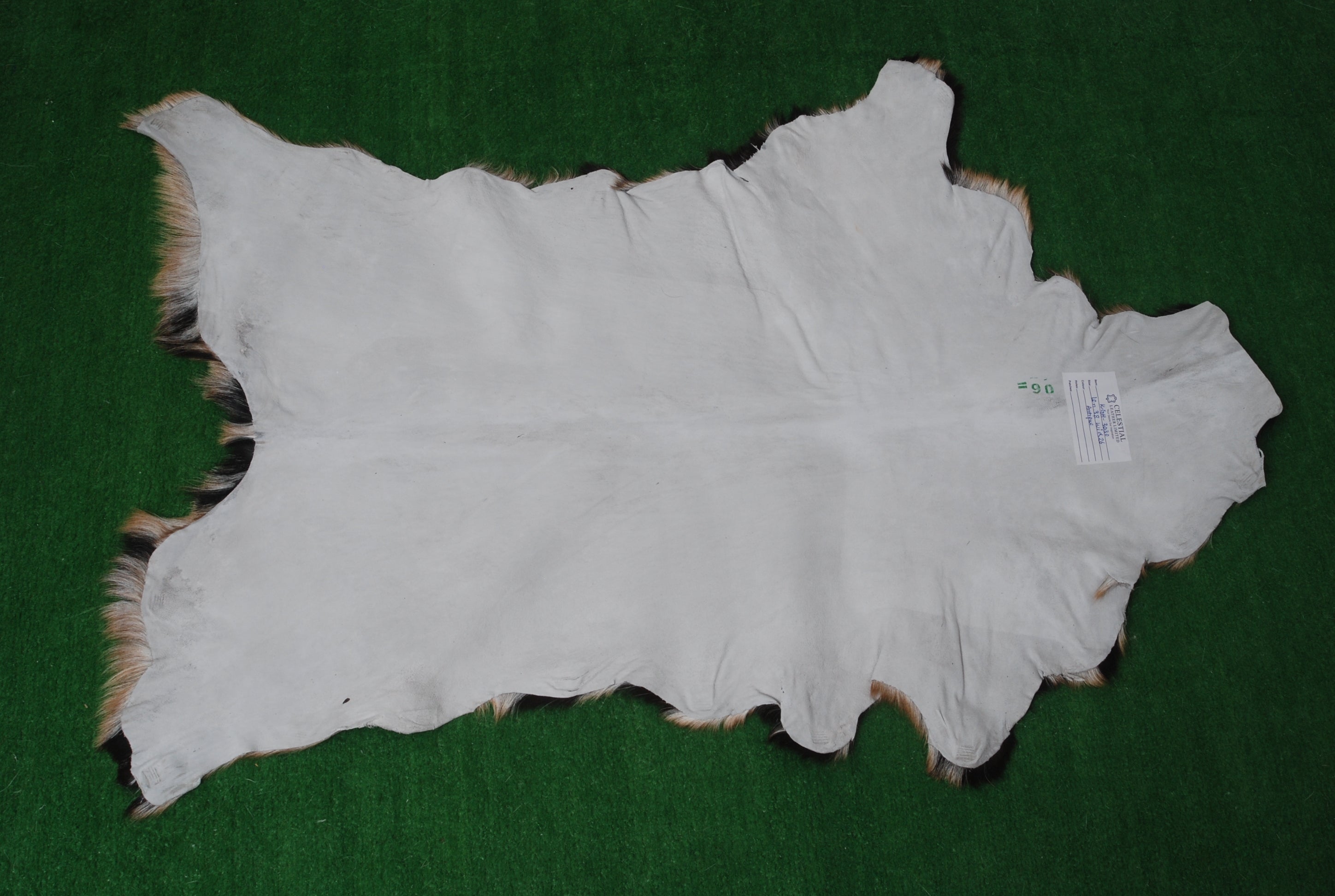 Handcrafted Tri-Color Goat Skin Rug - Soft and Durable for Elegant Interiors