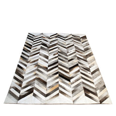 Luxurious Handmade Cowhide Patchwork Area Rug with Zig Zag Stitching - Unique & Practical Home Decor Accent