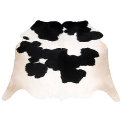Luxurious Handcrafted Black and White Cowhide Rug - Hypoallergenic, Non-Slip Backing, Unique Markings - Durable and Versatile Home Decor