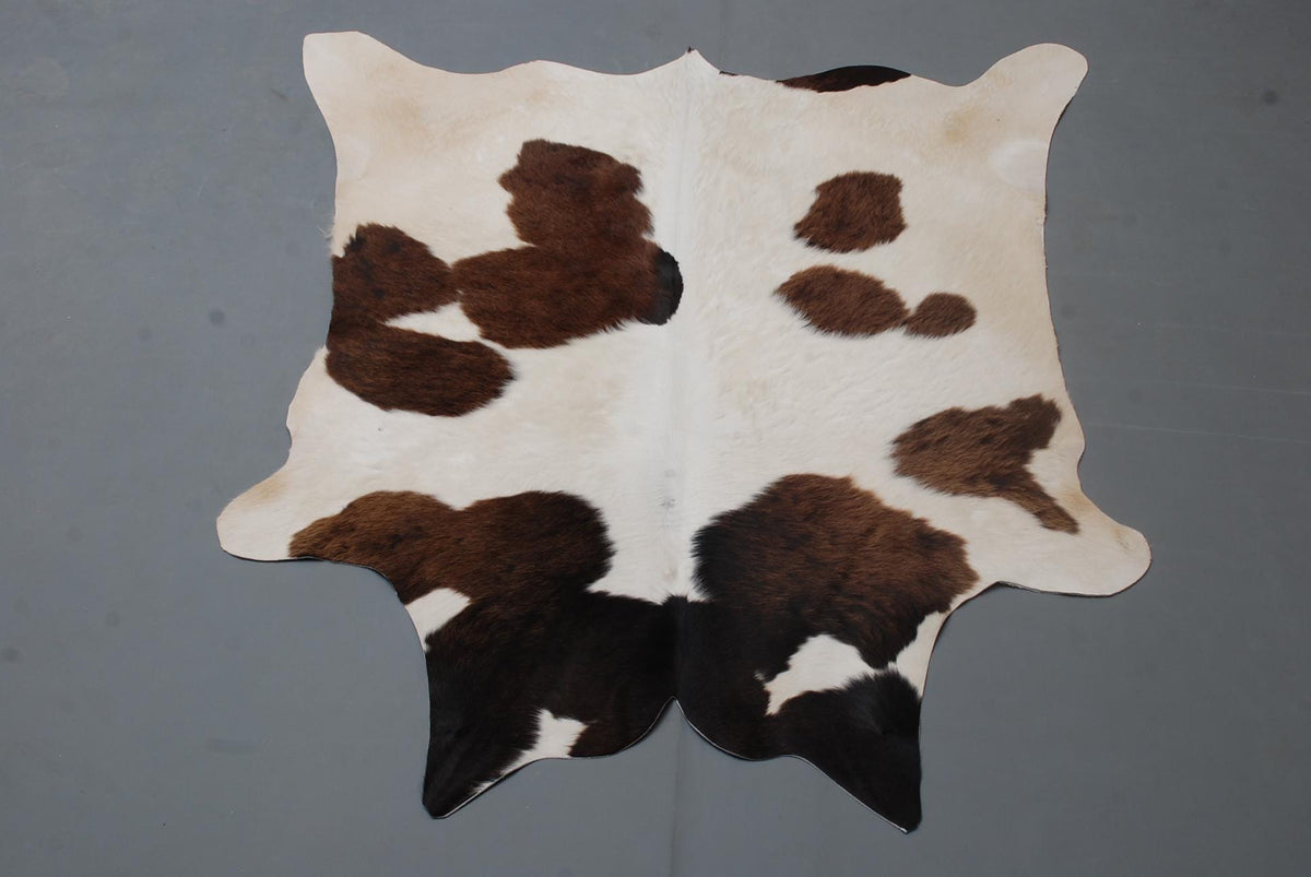 Luxury Handcrafted Brown & White Cowhide Rug - Hypoallergenic, Non-Slip Backing, Unique Natural Beauty - Durable - Versatile Home Decor