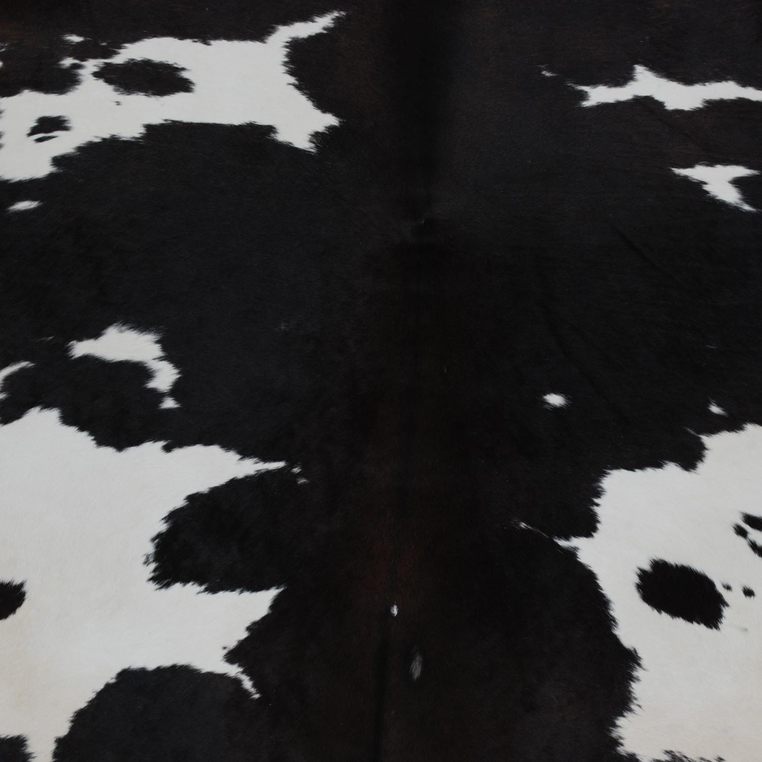 Luxury Handcrafted Medium Brown and White Cowhide Rug - Hypoallergenic, Non-Slip Backing, One-of-a-Kind Natural Beauty
