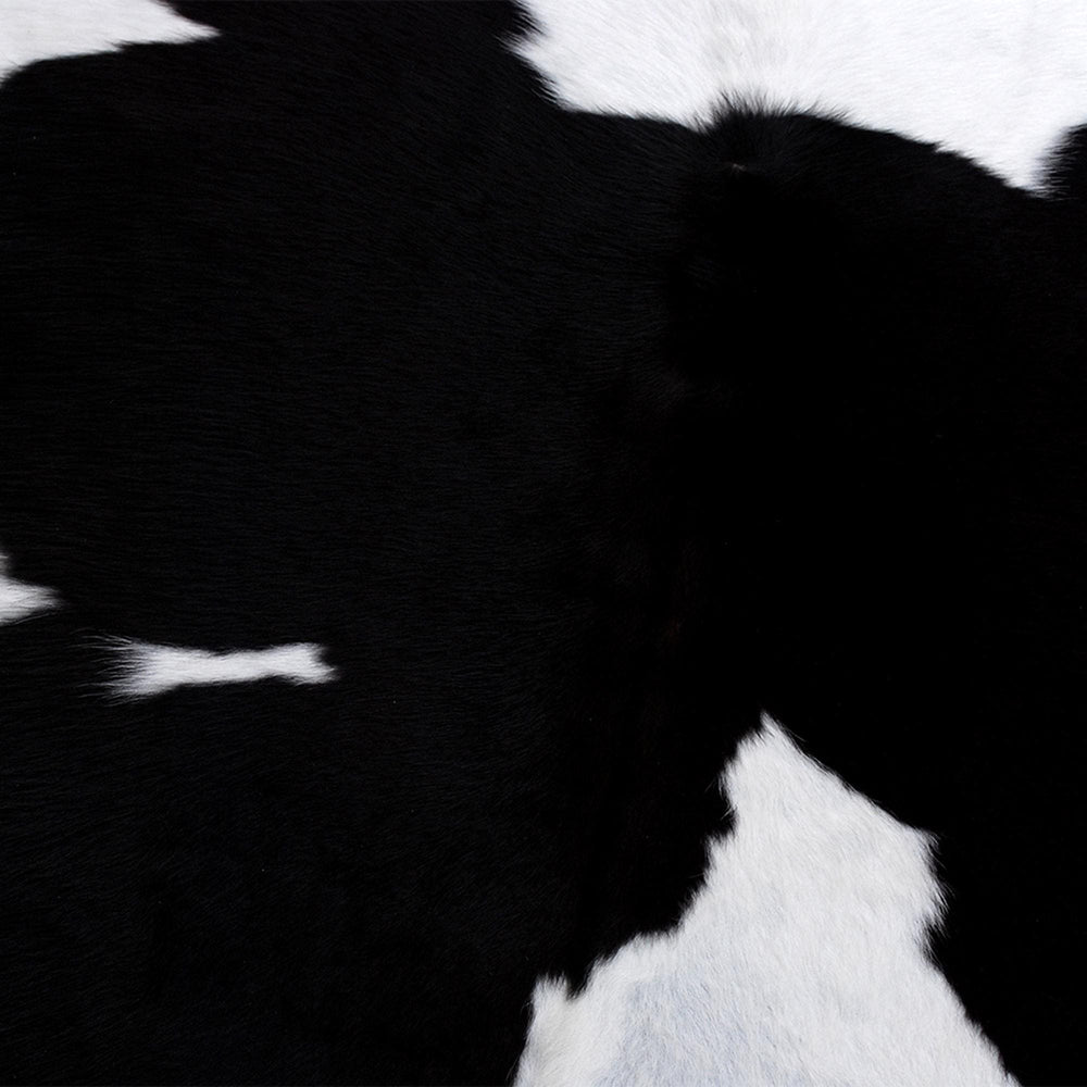 Stunning Black & White Cowhide Rug with Animal Print Design | Luxurious - Durable Accent for Home Decor - Celestial Leather Limited