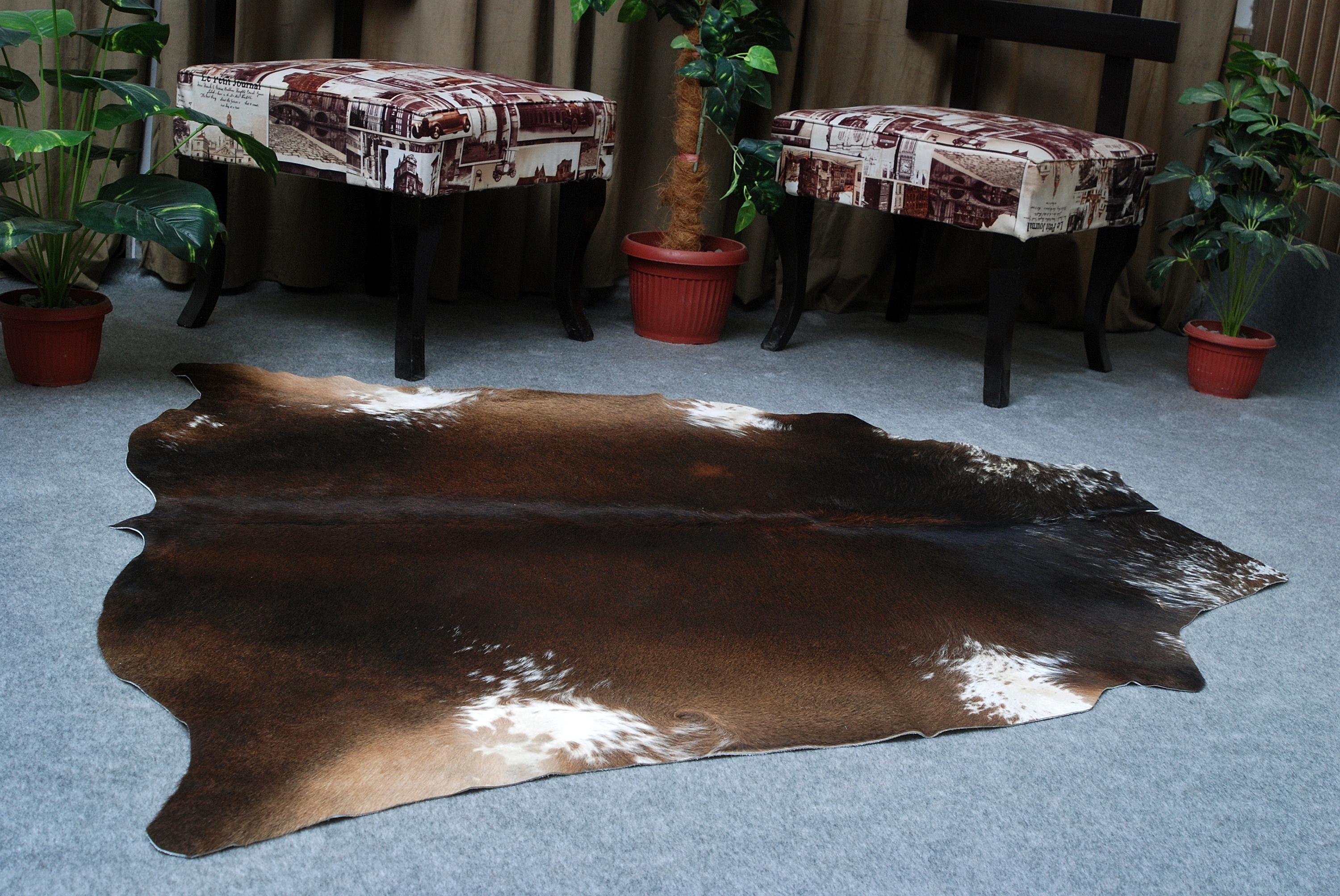 Luxurious Dark Brown and White Cowhide Rug for Sophisticated Lounge Decor - Celestial Leather Limited