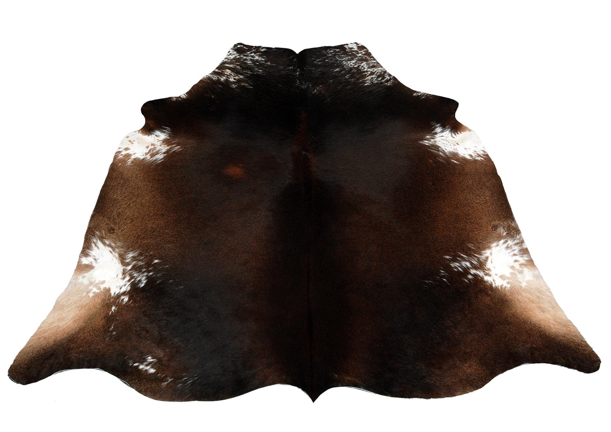 Luxurious Dark Brown and White Cowhide Rug for Sophisticated Lounge Decor - Celestial Leather Limited