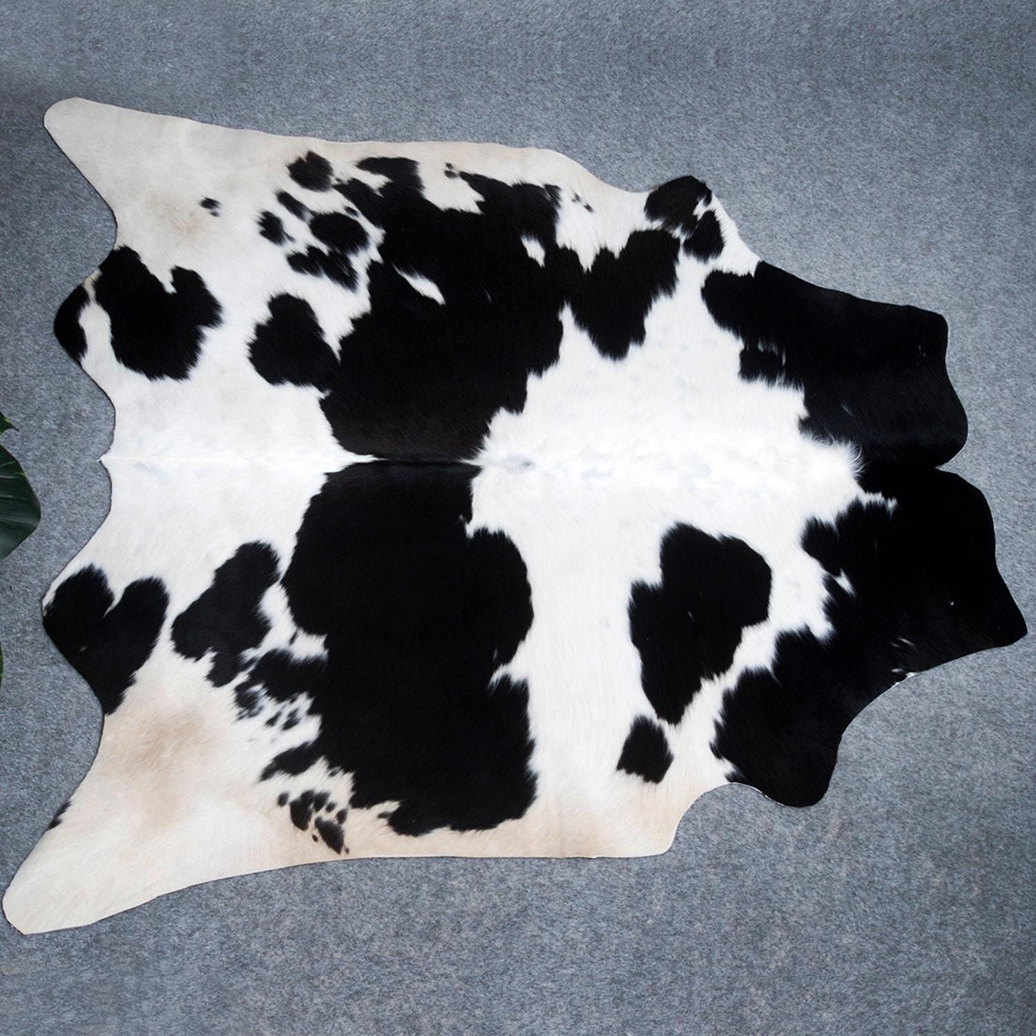 Luxurious Black and White Cowhide Rug with Non-Slip Backing - Hypoallergenic, Handcrafted Medium Salt & Pepper Hair on Hide for Home Décor