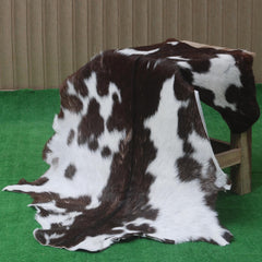 Luxurious Brown and White Goat Hide Rug - Premium Hair-On Rug with Unique Patterns and Non-Slip Suede Back - Sustainable and Eco-Friendly