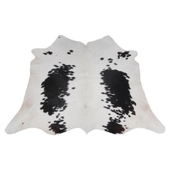 Luxurious Black and White Cowhide Rug - Handcrafted, Hypoallergenic, Non-Slip Backing, Unique Natural Beauty and Durability - Celestial Leather Limited