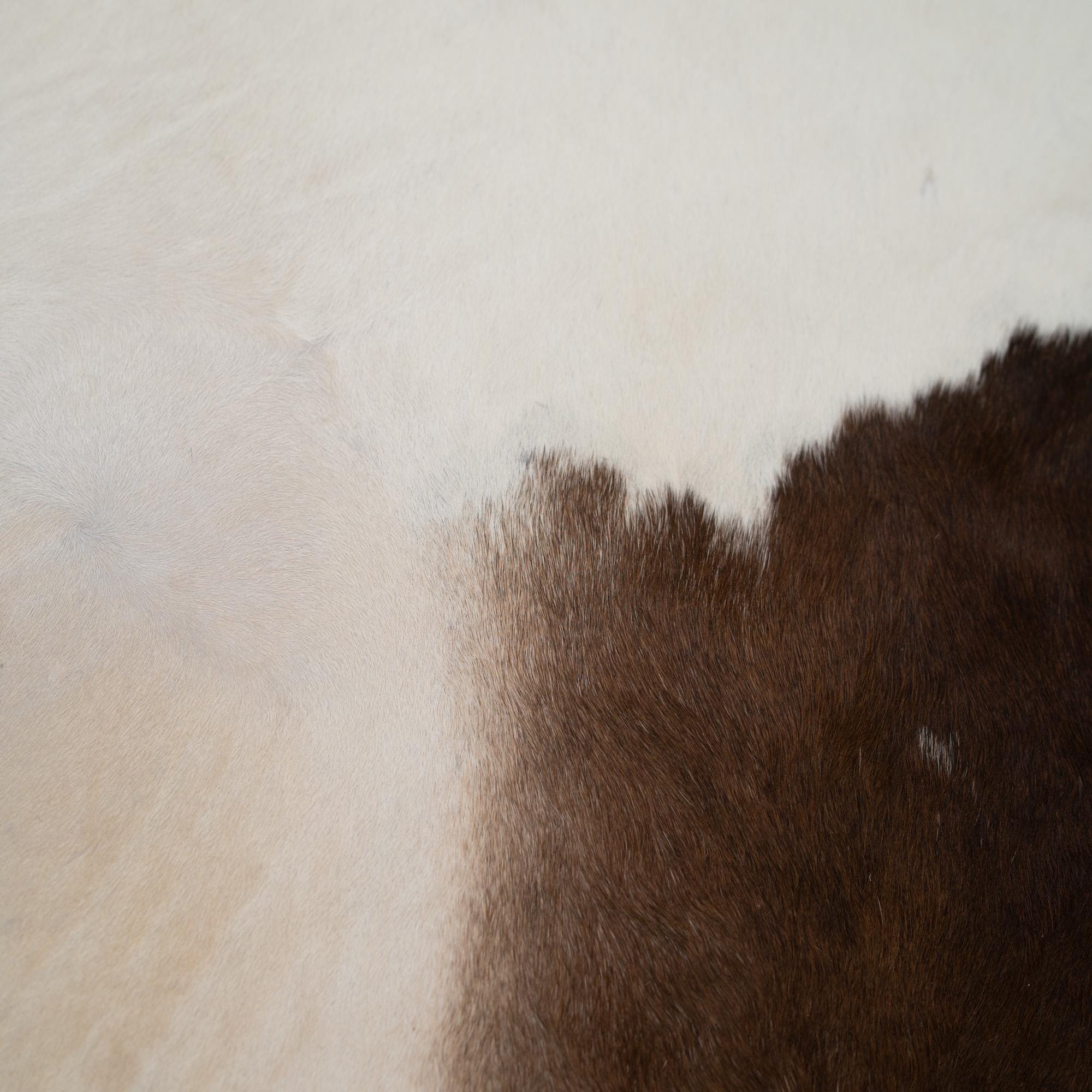 Luxurious Brown and White Cowhide Rug - Hypoallergenic, Non-Slip Backing, Non-Shedding - Perfect for Upholstery and Home Décor