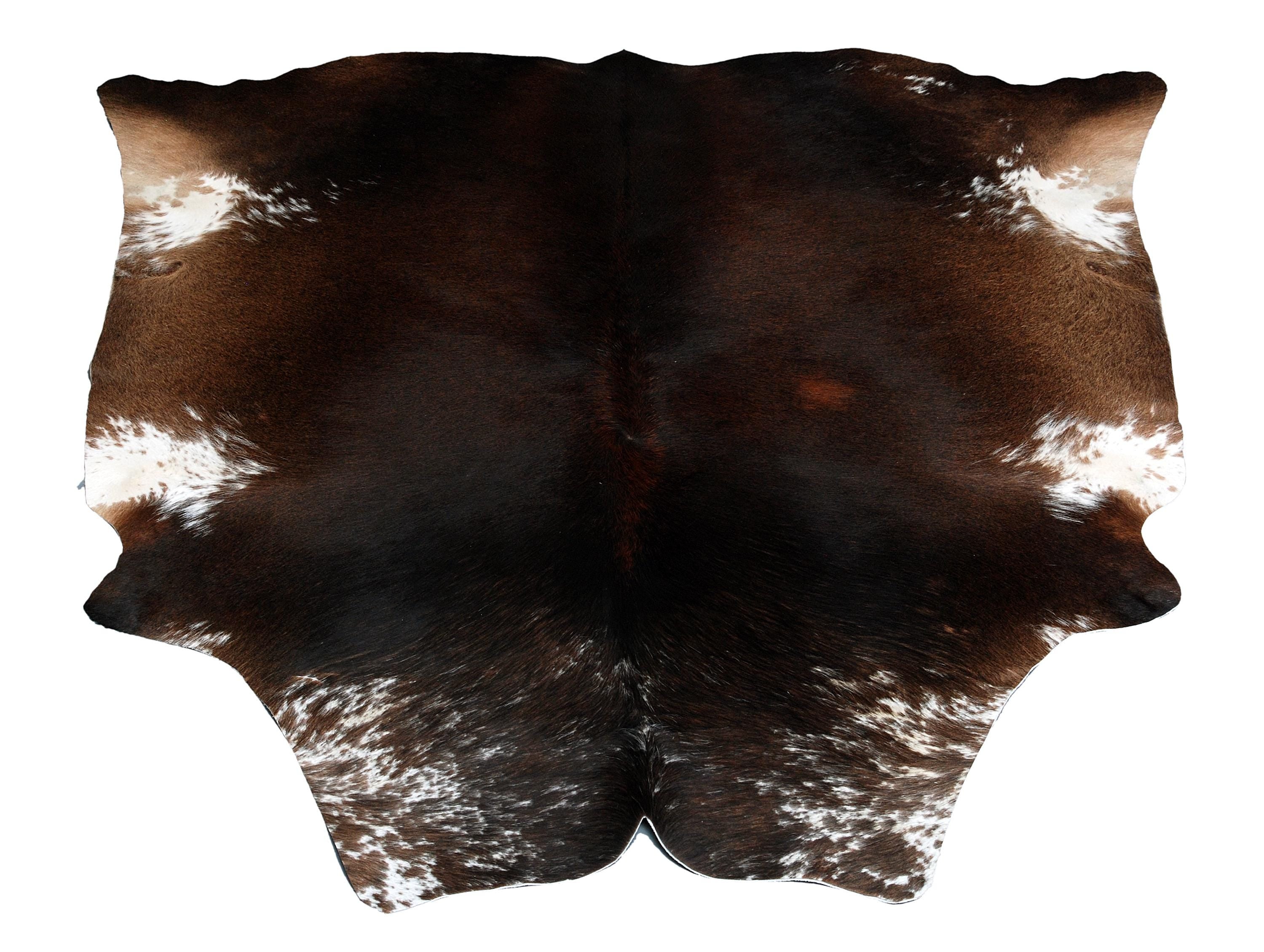 Luxurious Dark Brown and White Cowhide Rug for Sophisticated Lounge Decor - Celestial Leather Limited